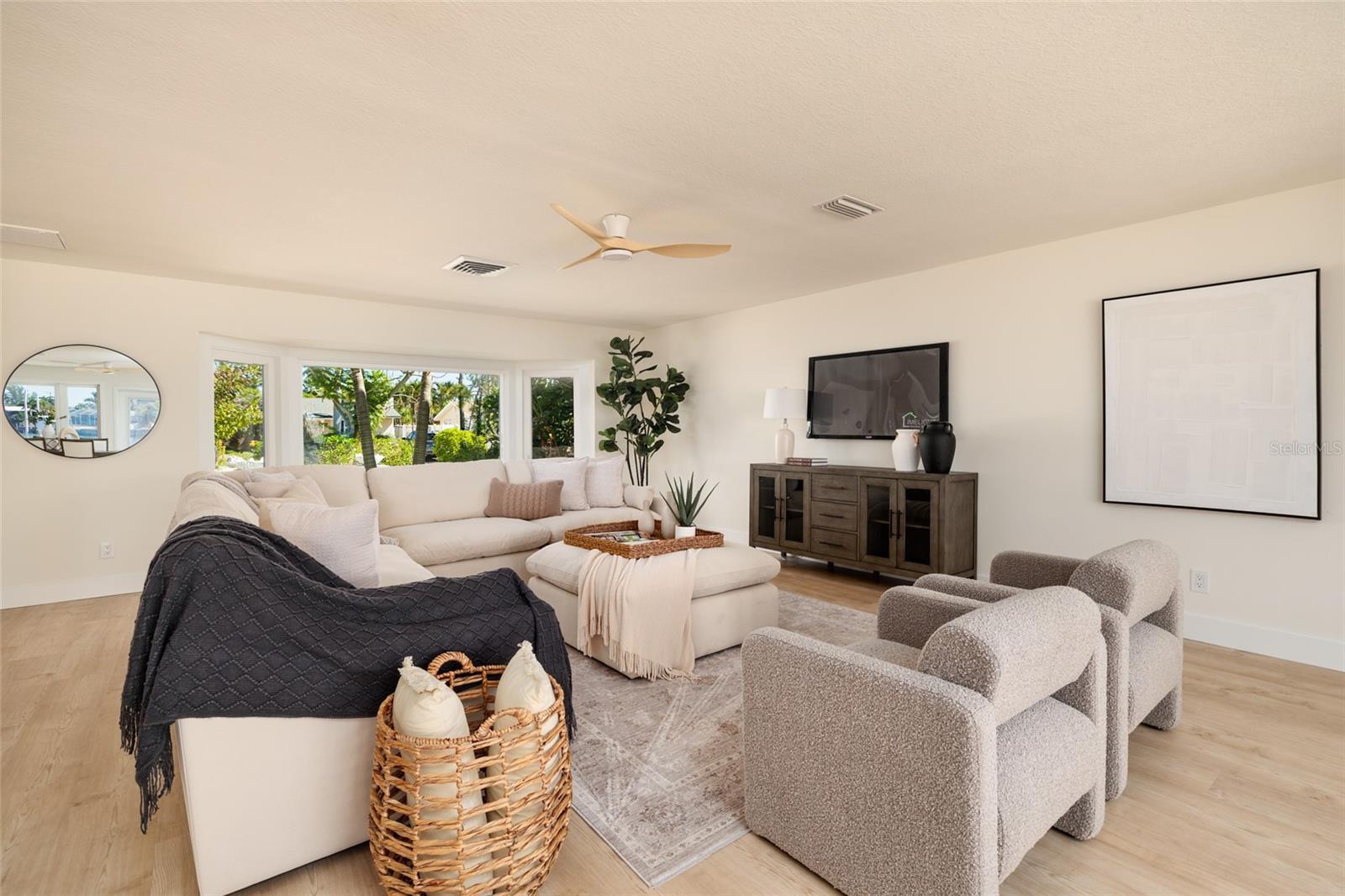 Spacious open concept living room offers abundant natural light and flow