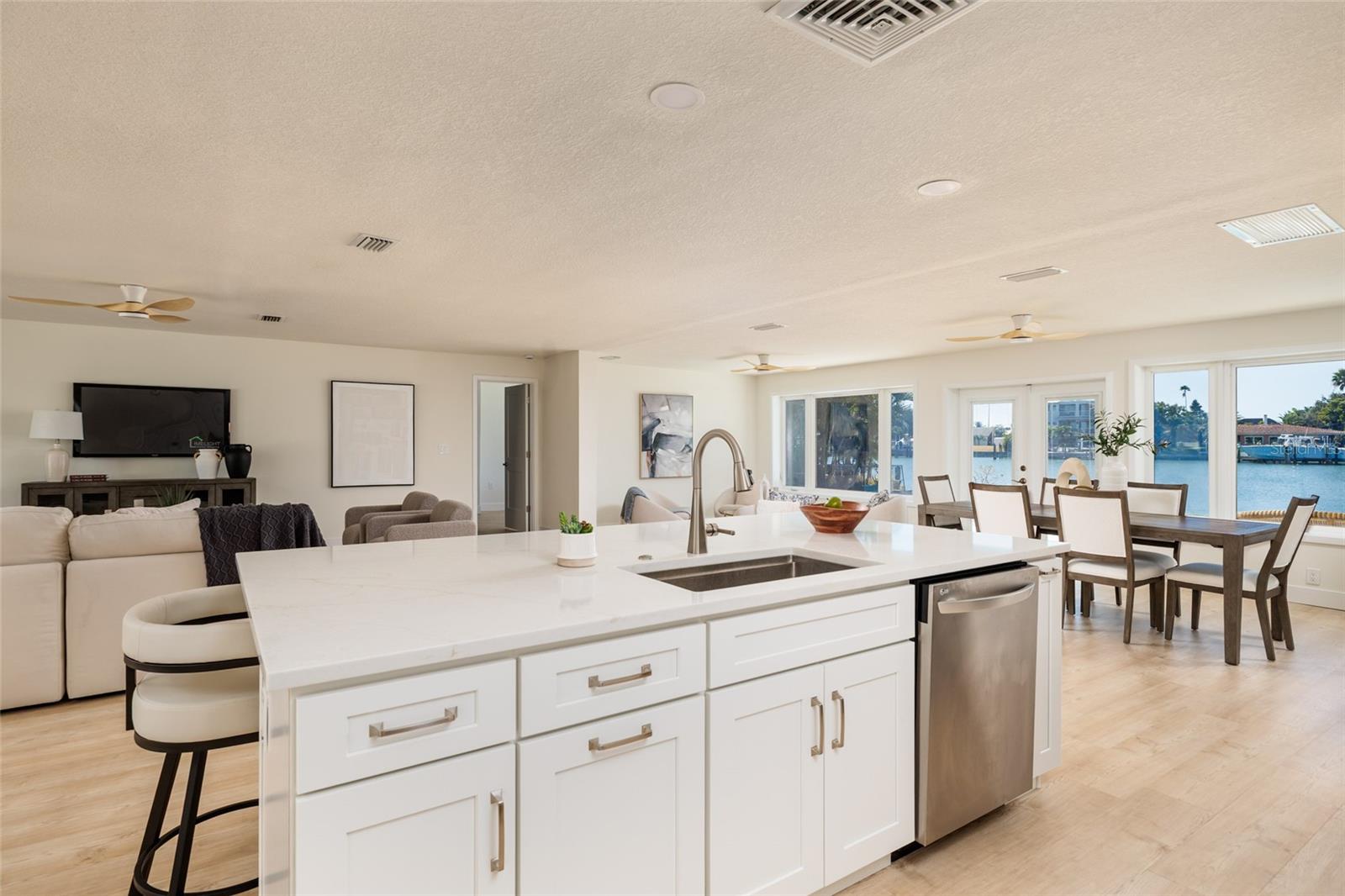 Gourmet chef's kitchen boasts granite countertops and bright open concept design