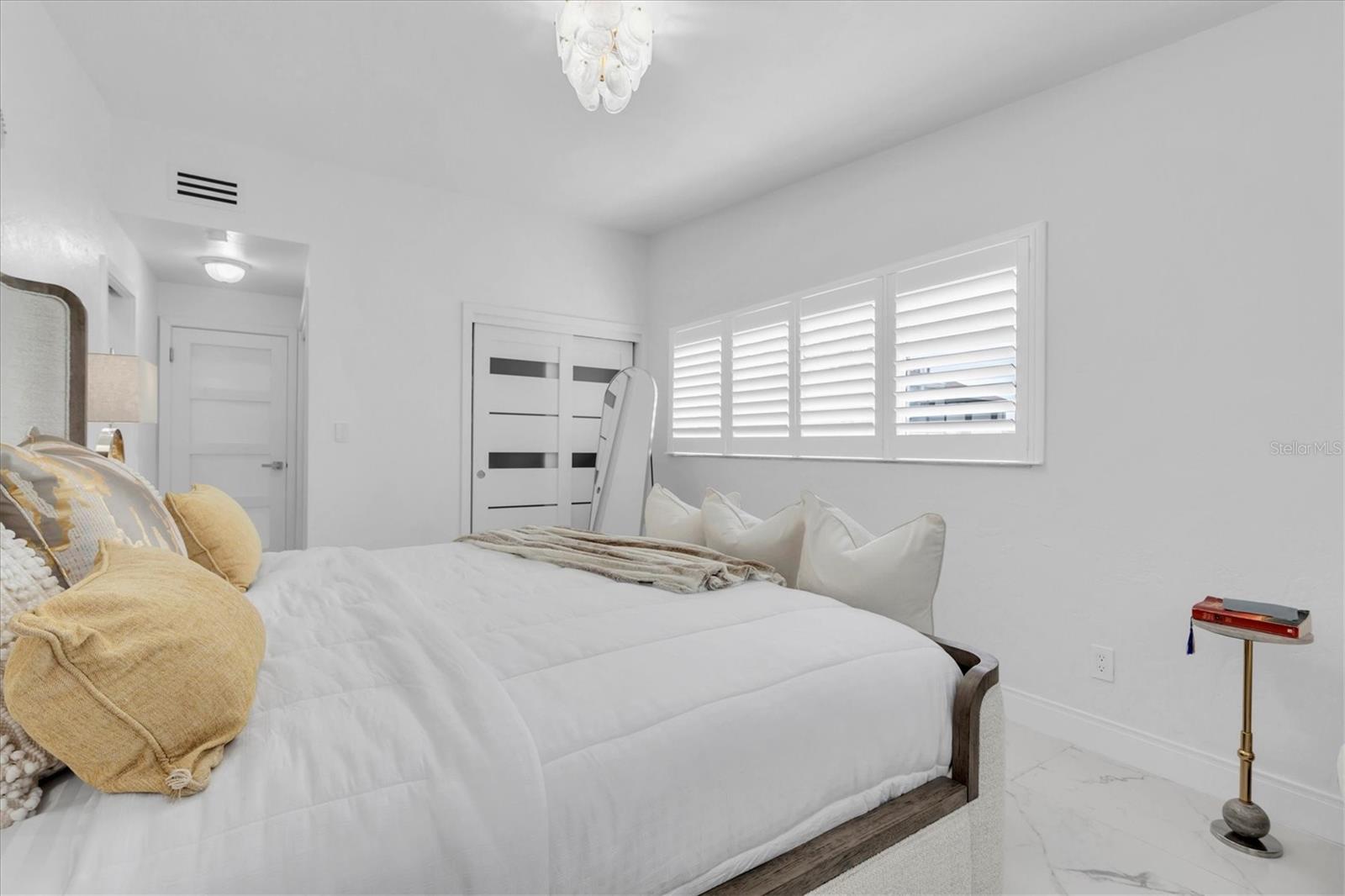 The primary bedroom features plenty of space with a private full bathroom.