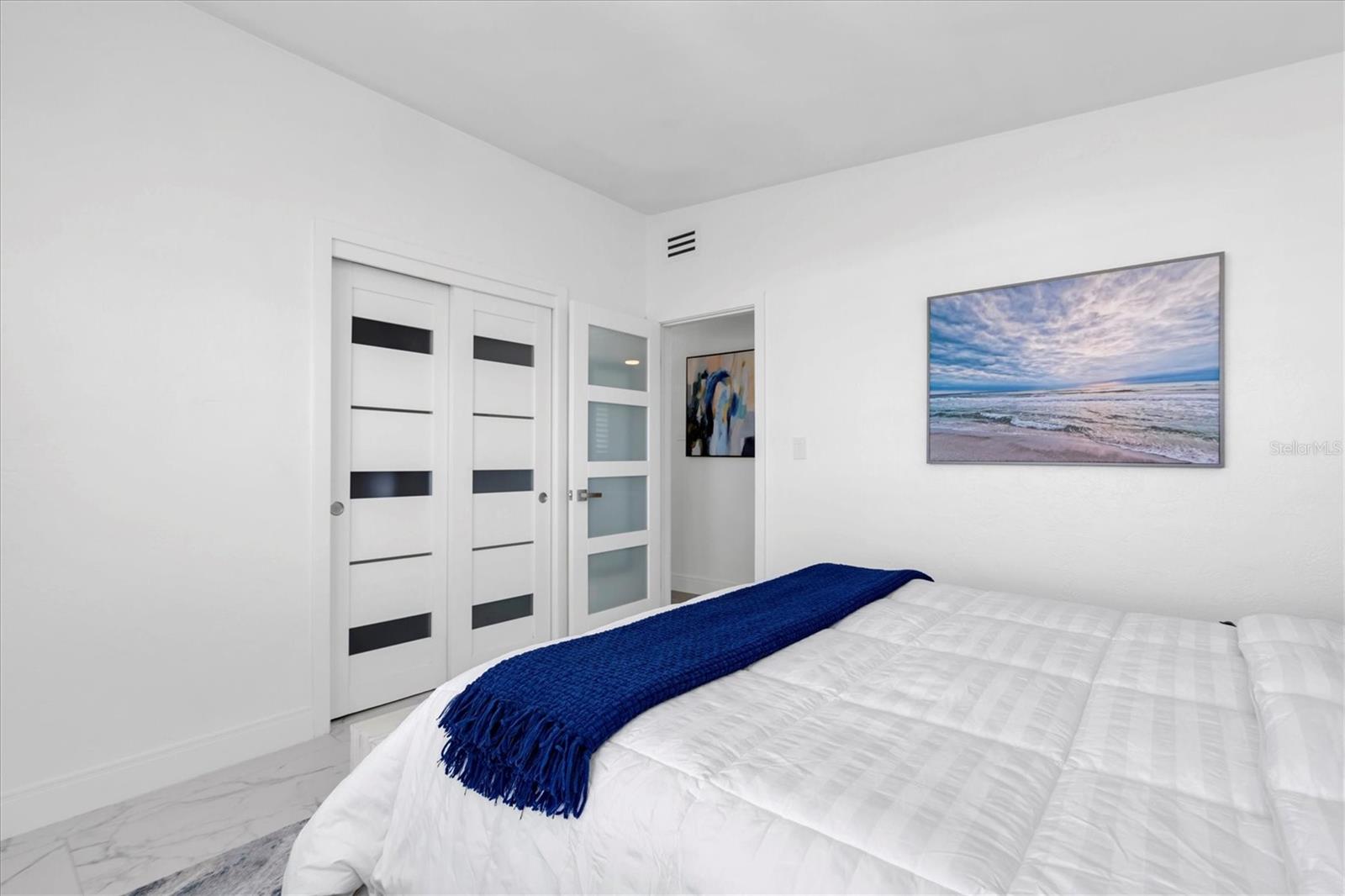 The third bedroom is also spacious featuring sliding closet doors.