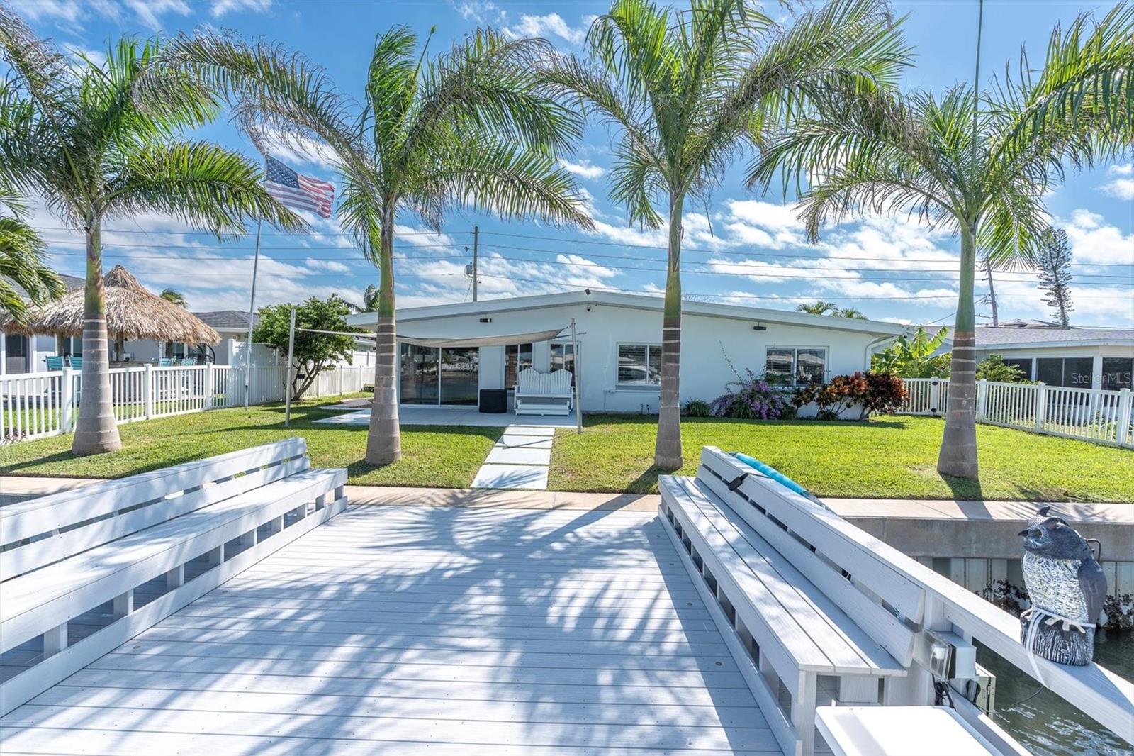 Spacious dock with durable composite decking, equipped with water and electricity for convenience.