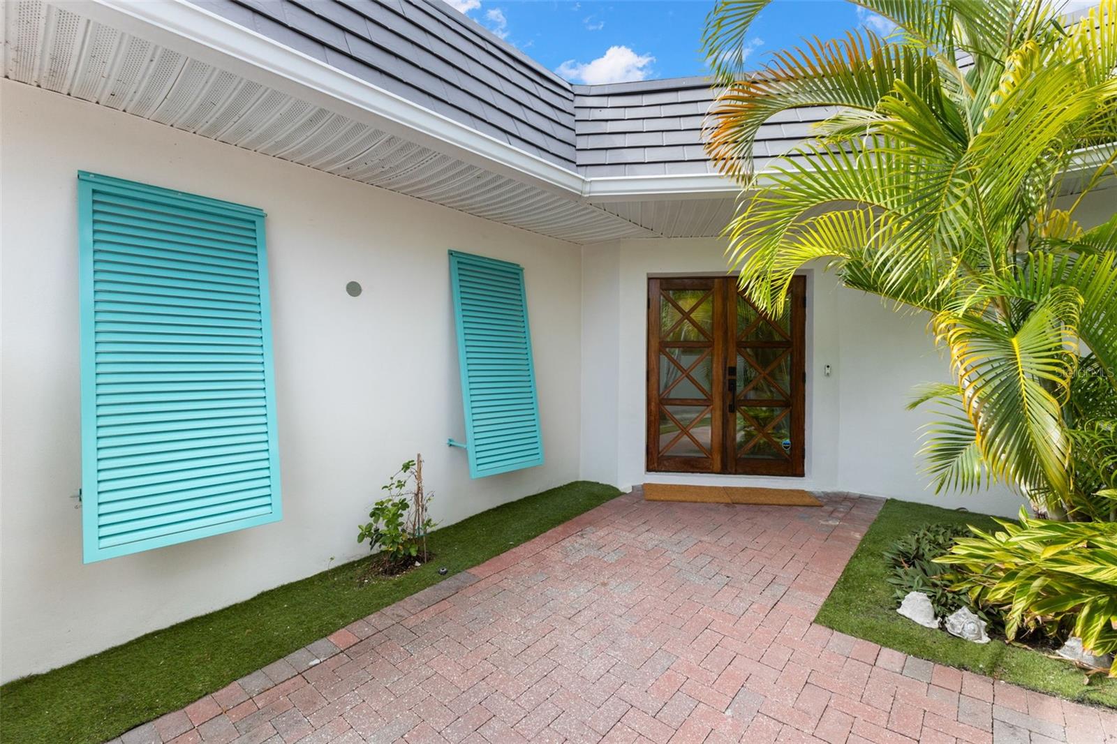 Paver Courtyard and Custom Front Doors