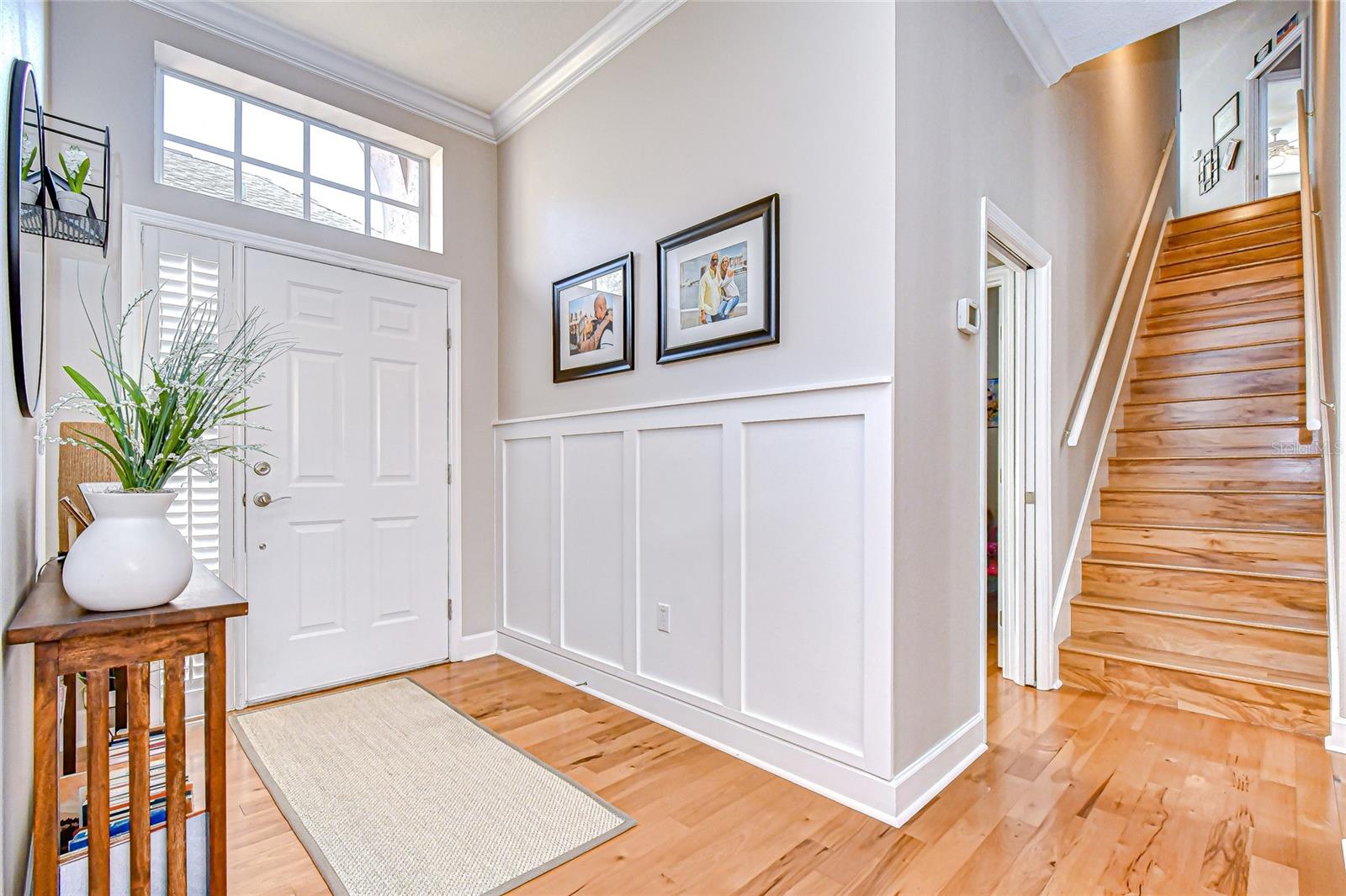 Rich wood flooring welcomes you inside!