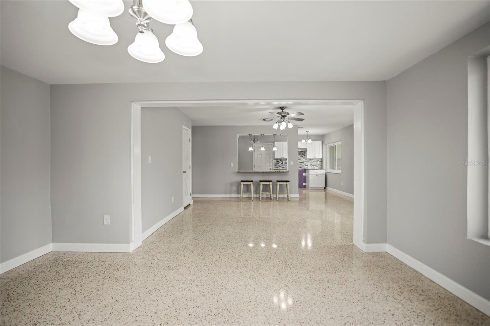 Living Room open to dining area and the kitchen with breakfast counter
