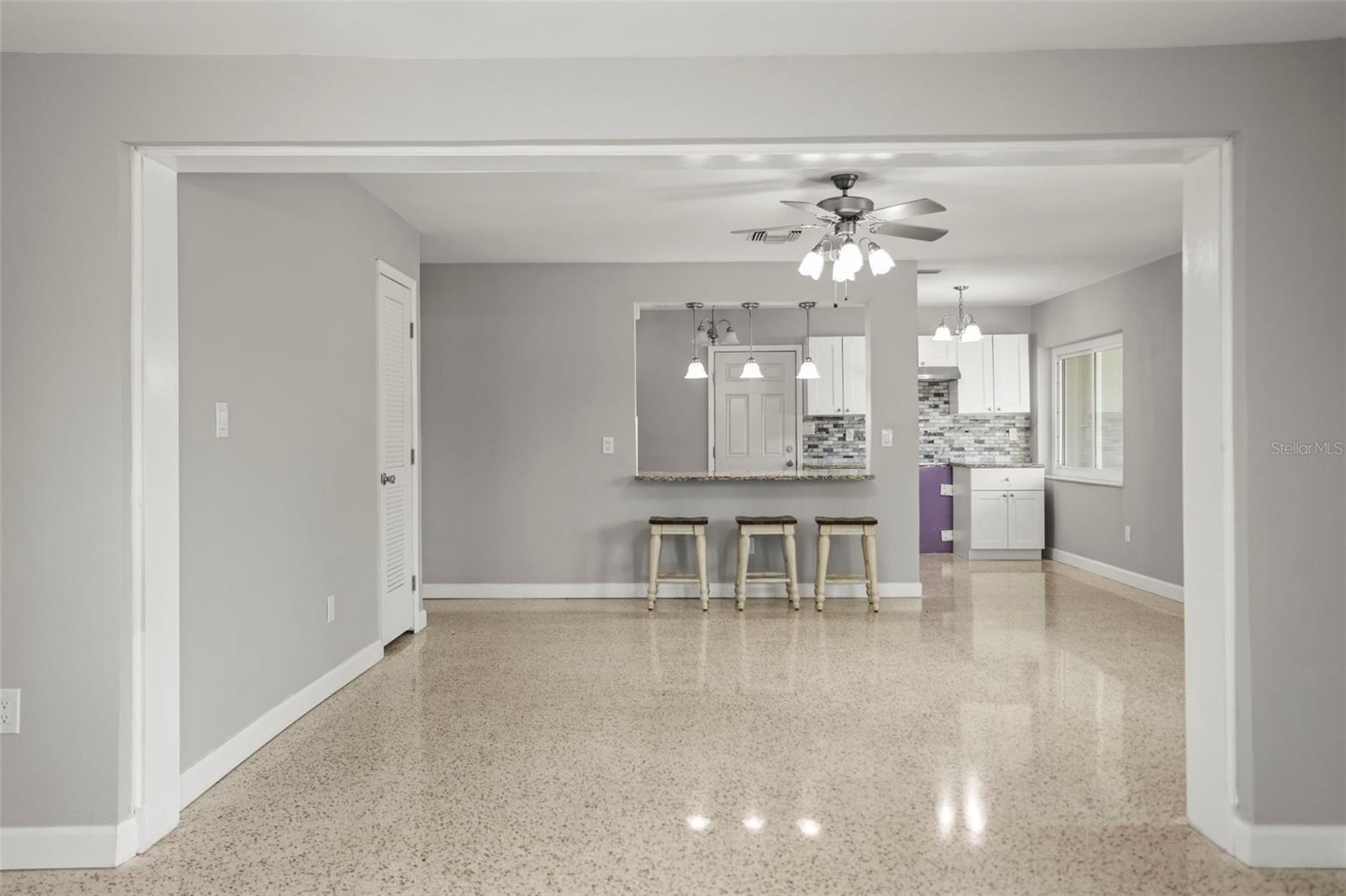 Living Room open to dining area and the kitchen with breakfast counter
