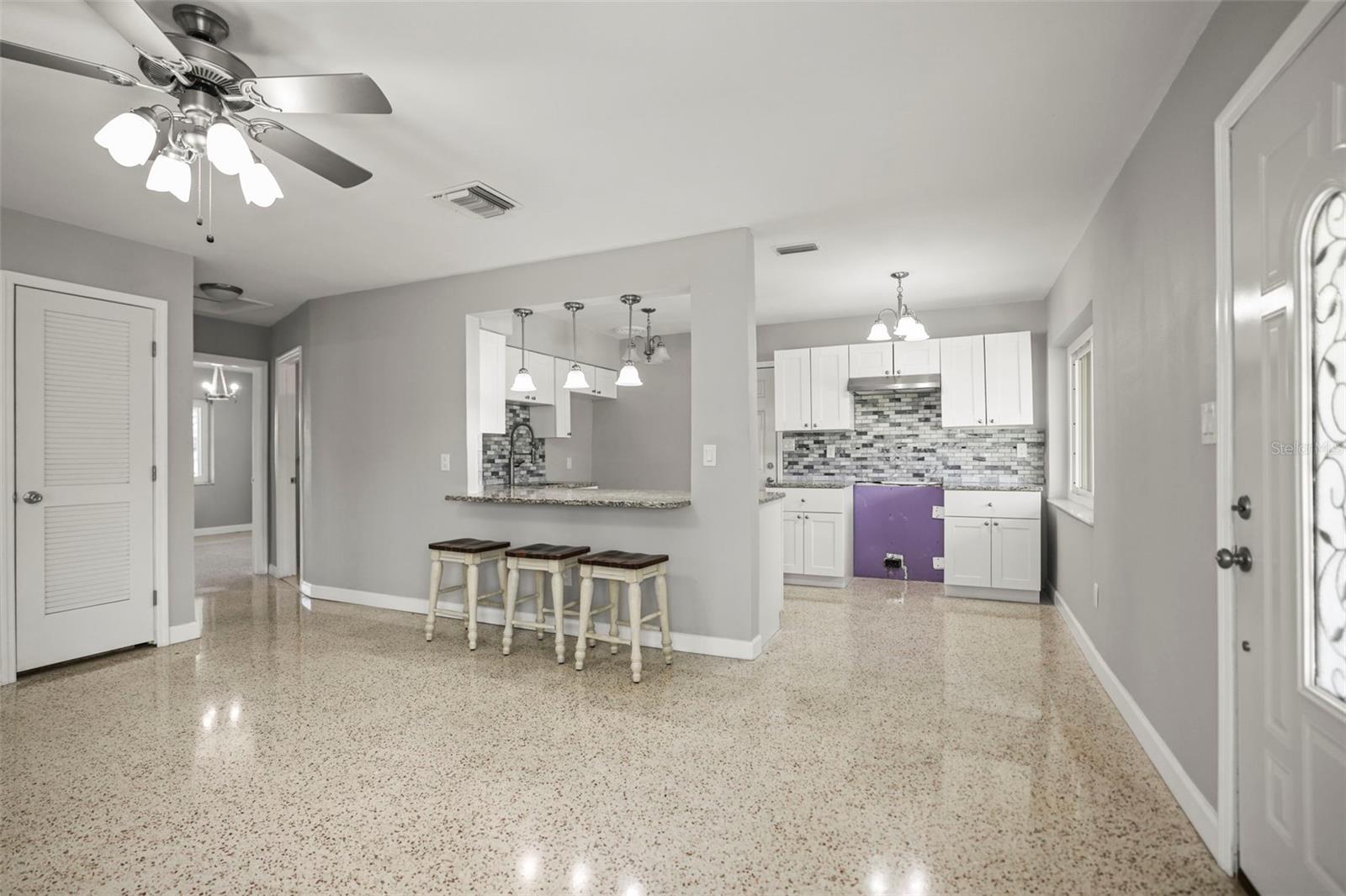 Living Room open to dining area and the kitchen with breakfast counter