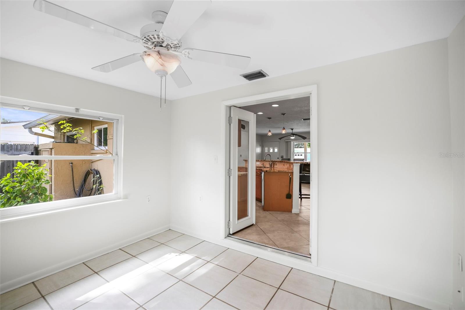 Bonus Room with glass french doors opening to the kitchen