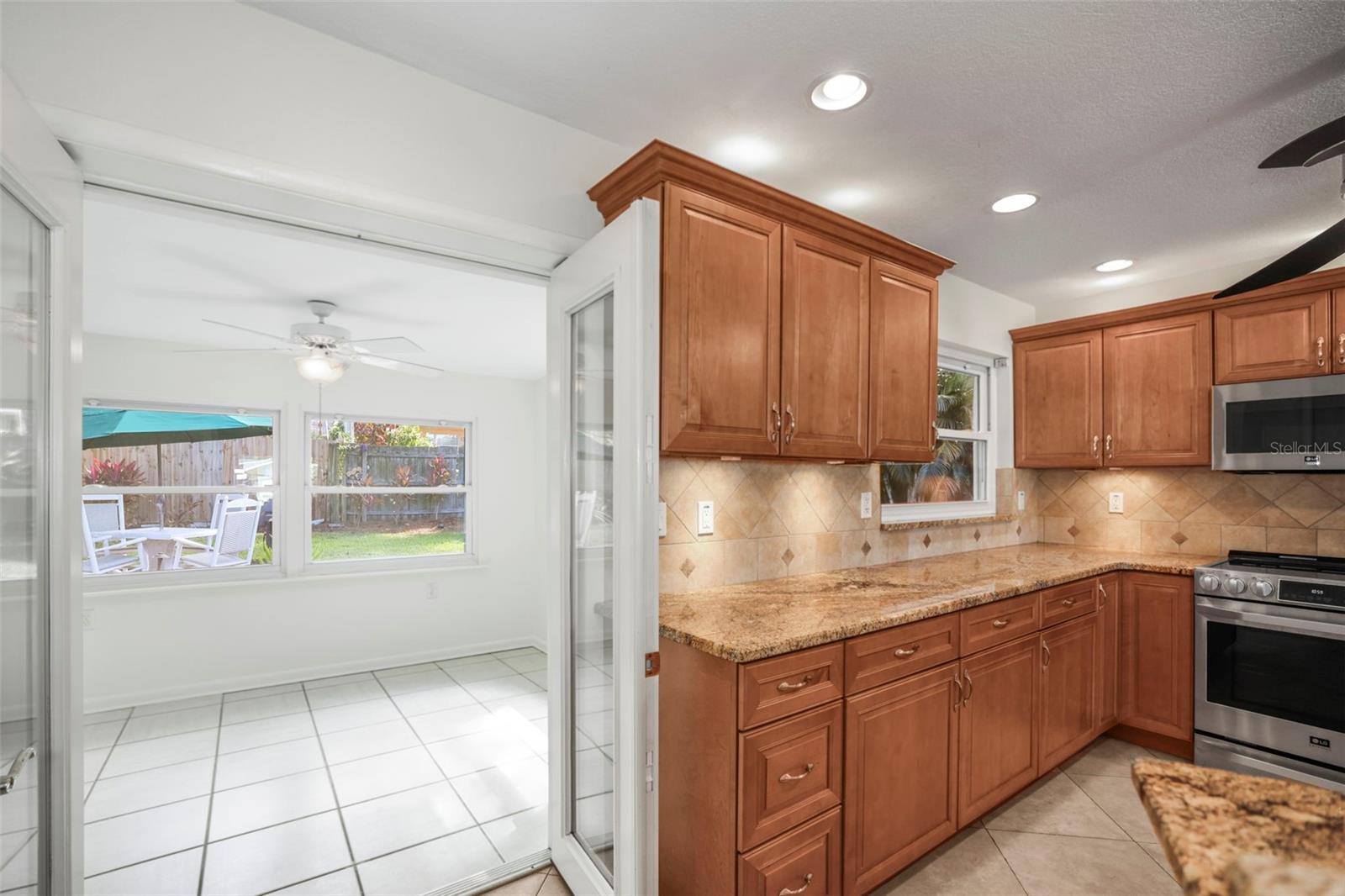 view of bonus room next to the kitchen