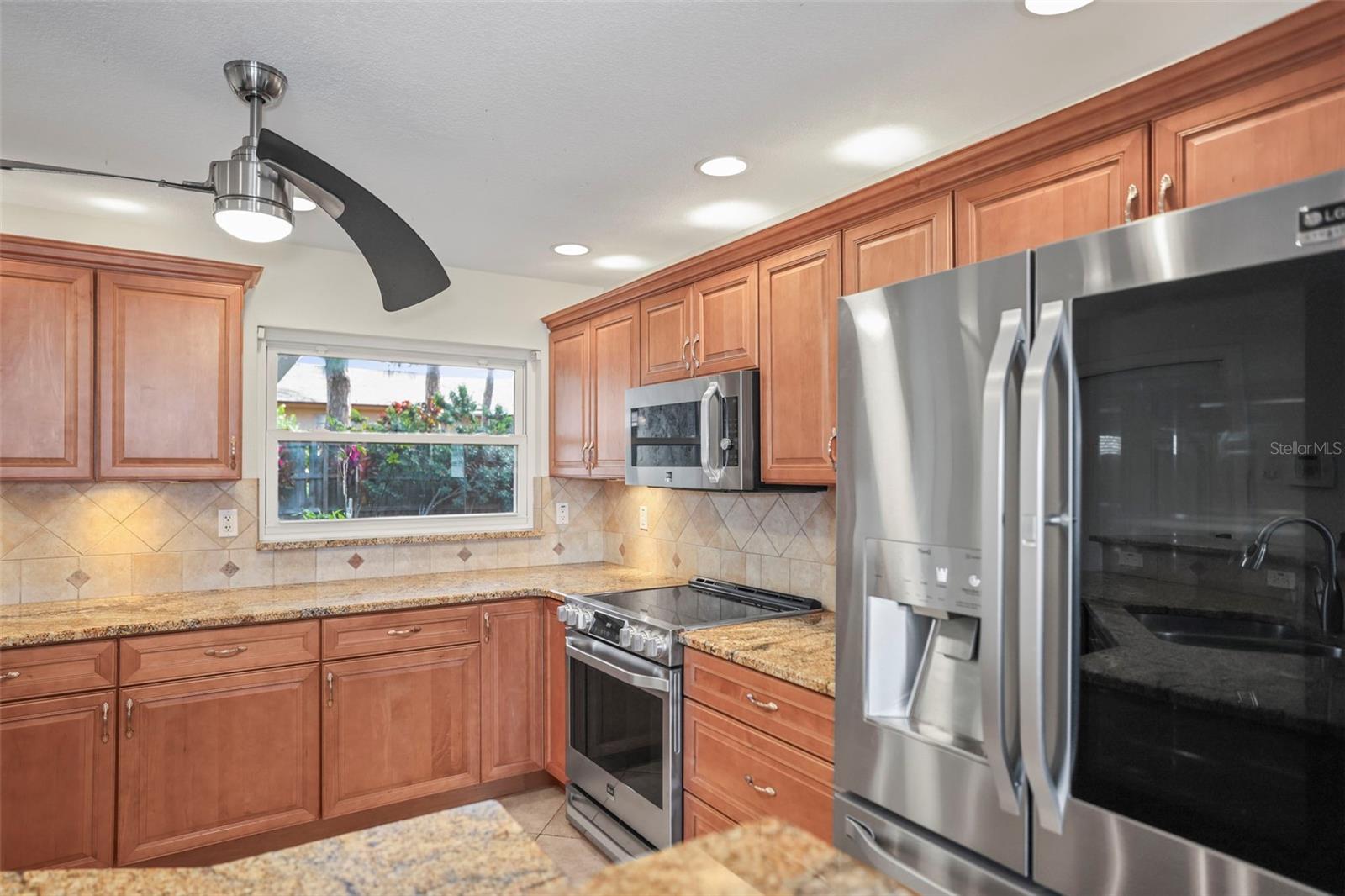 Maple cabinets, granite countertops with stainless steel appliances