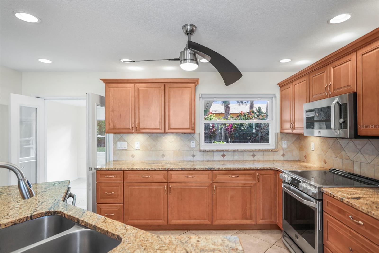Maple cabinets, granite countertops with stainless steel appliances