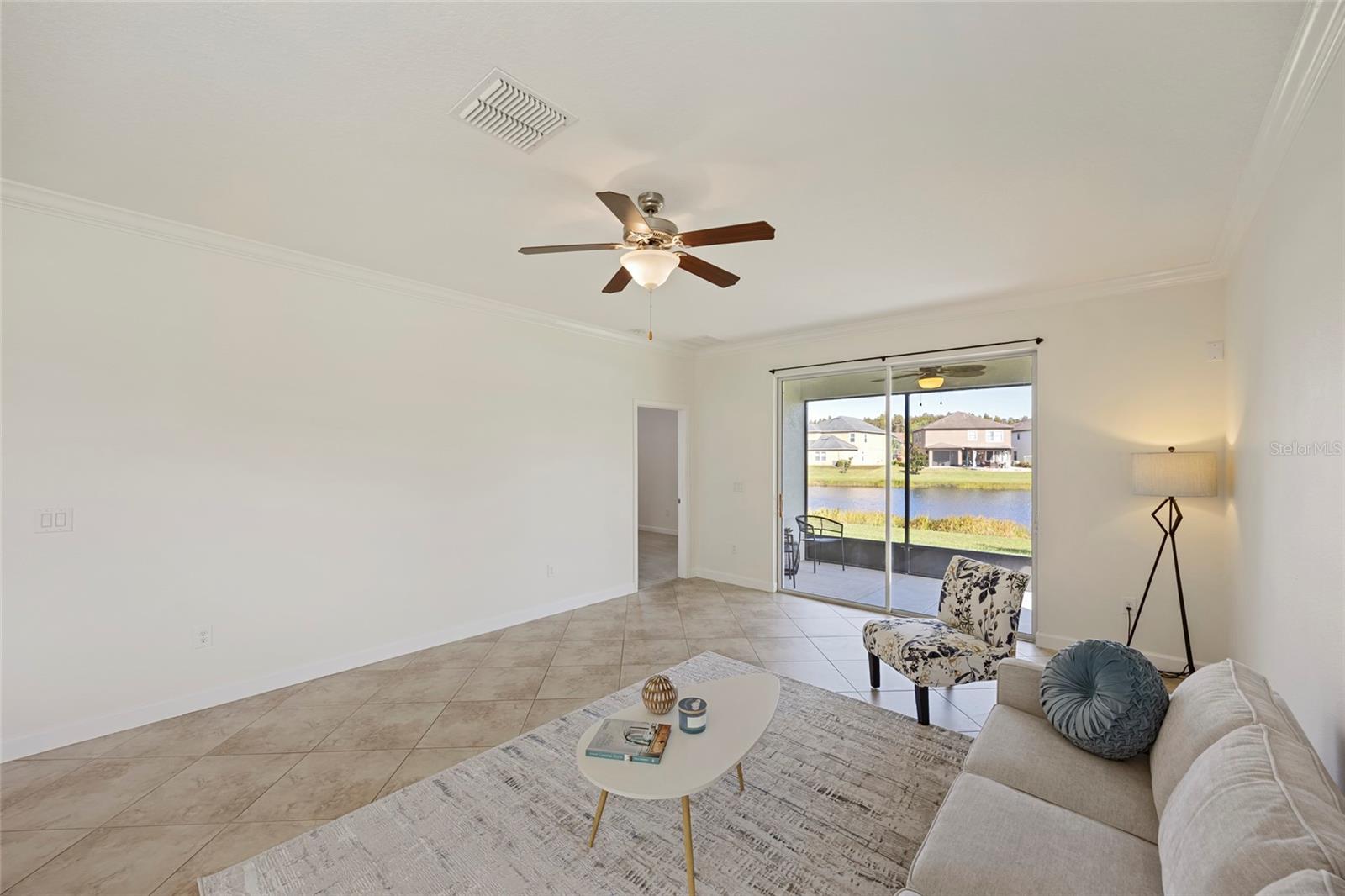 Living Room with sliders sliding to back patio