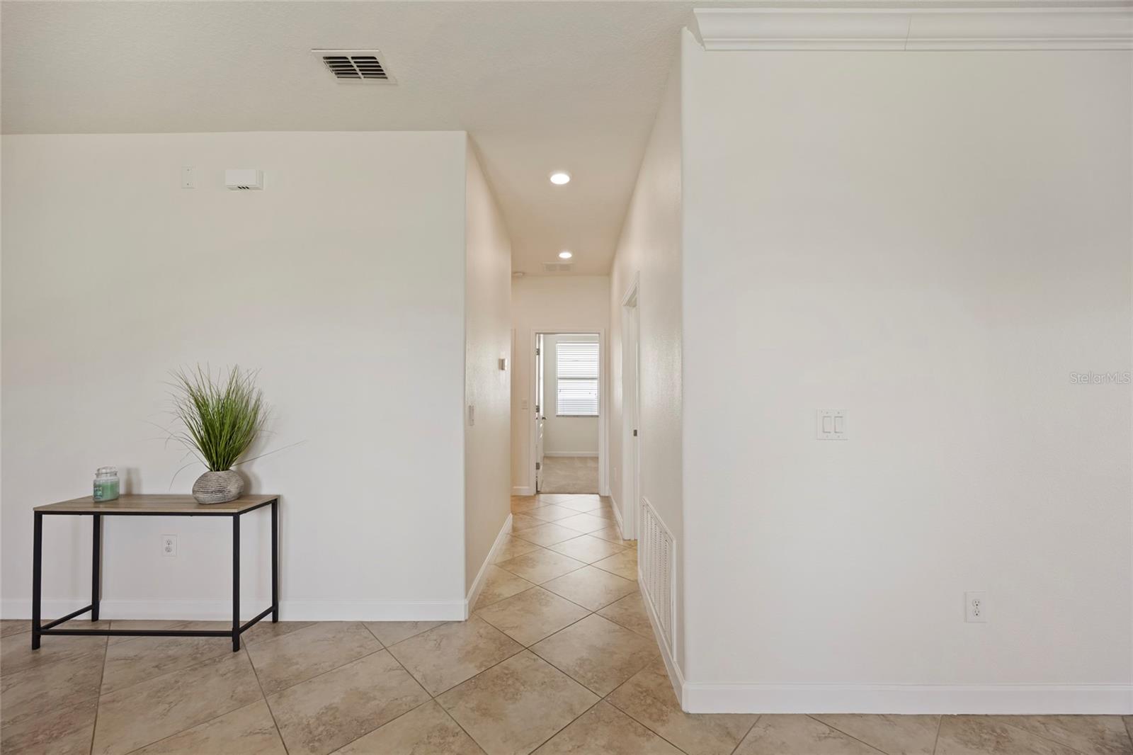 Hallway leading to 2 bedrooms and full bath