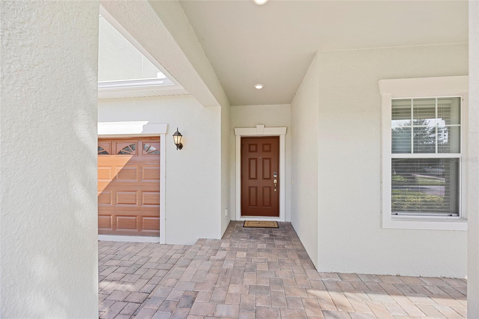 Covered and spacious front porch entry