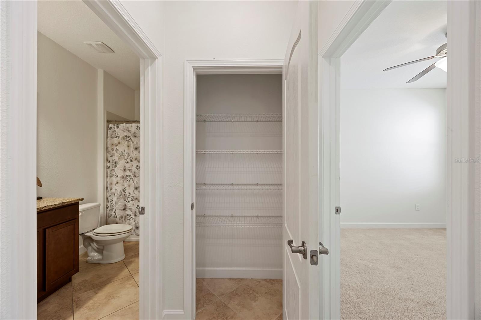 Linen closet outside full bathroom