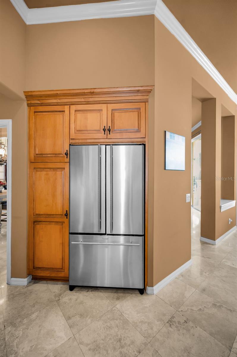 Jenn-Air refrigerator and closet pantry with pull-out drawers