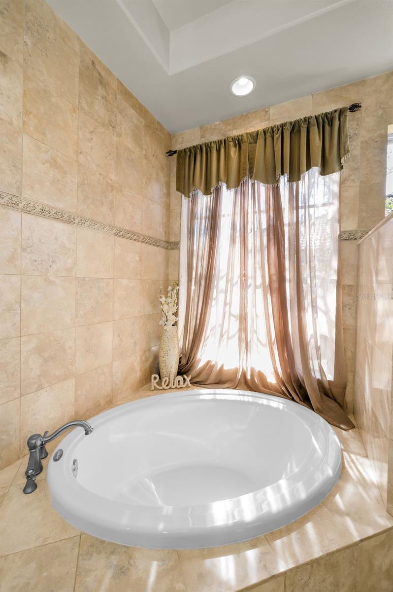 Soaking tub in primary bathroom