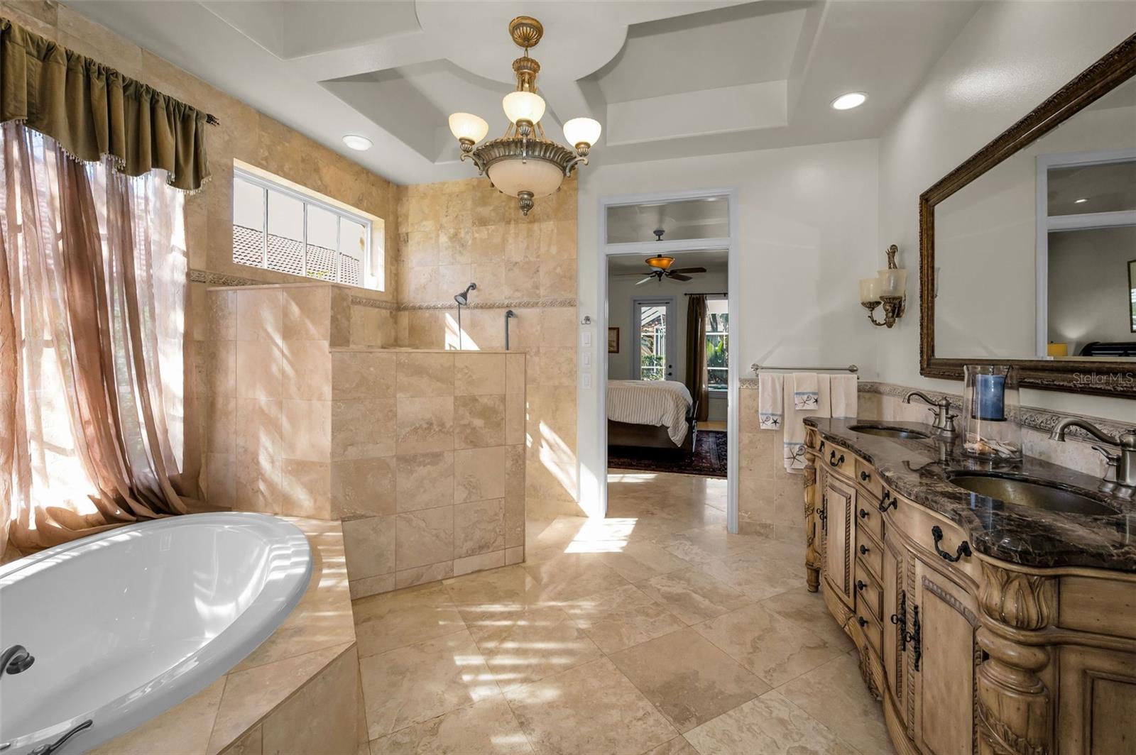 Soaking tub and walk-in shower in primary bathroom