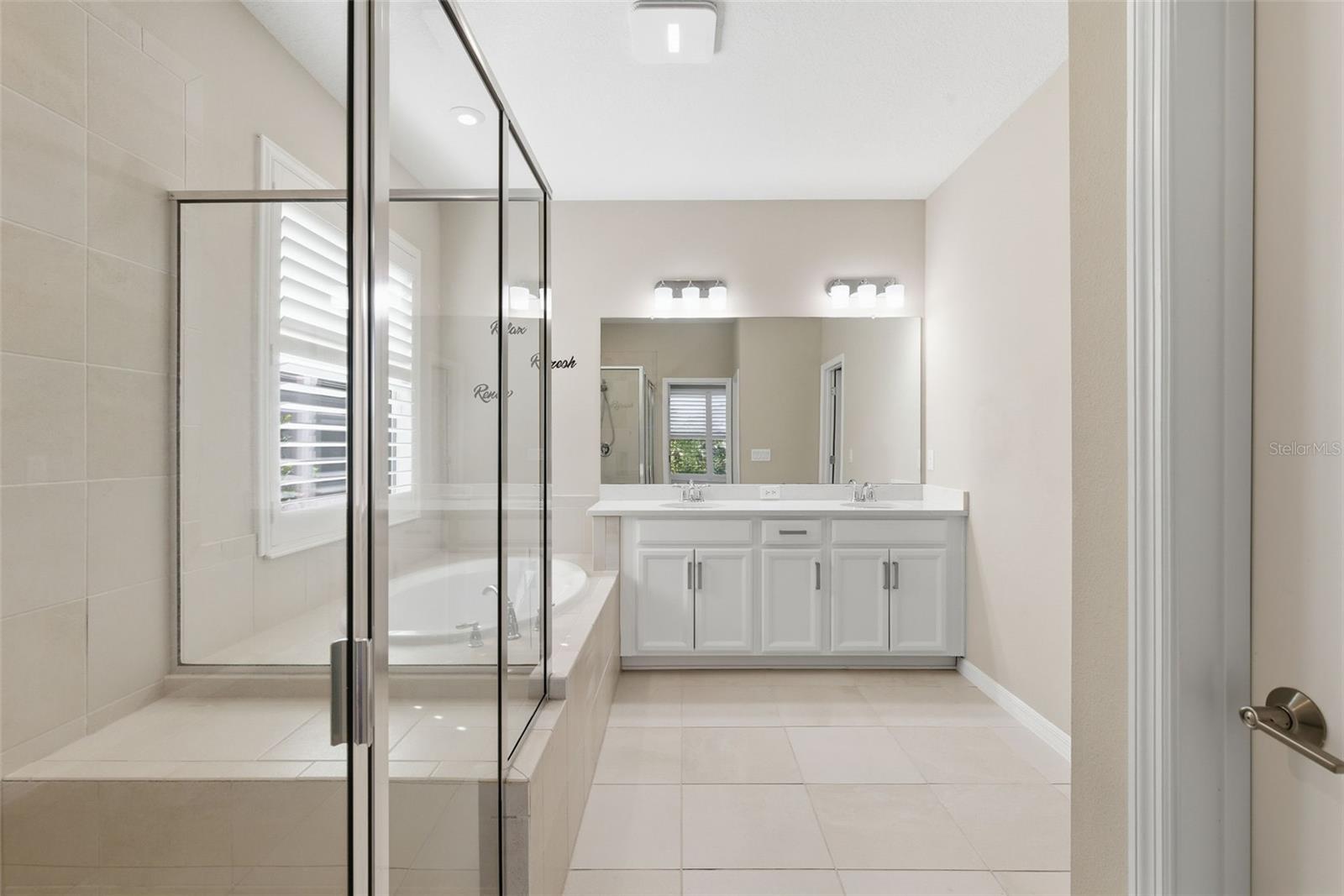 Primary En-Suite: Dual Sink Vanity, Walk-in Glass Shower