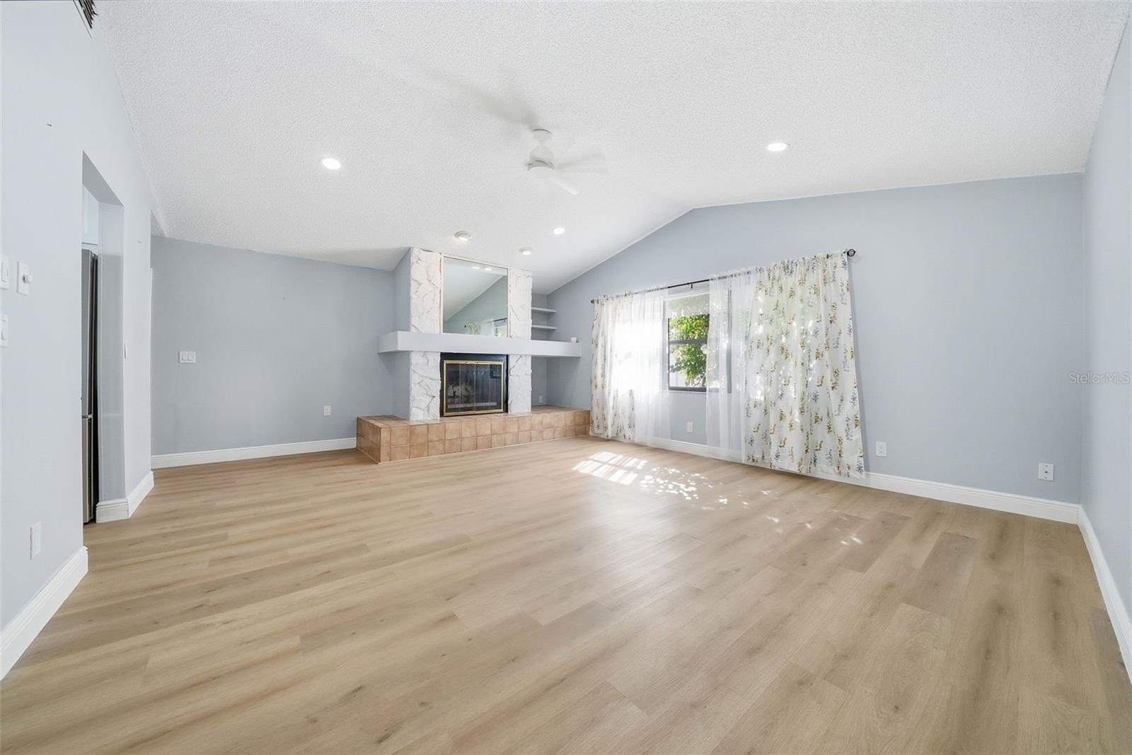 Living Room with Wood-Burning Fireplace