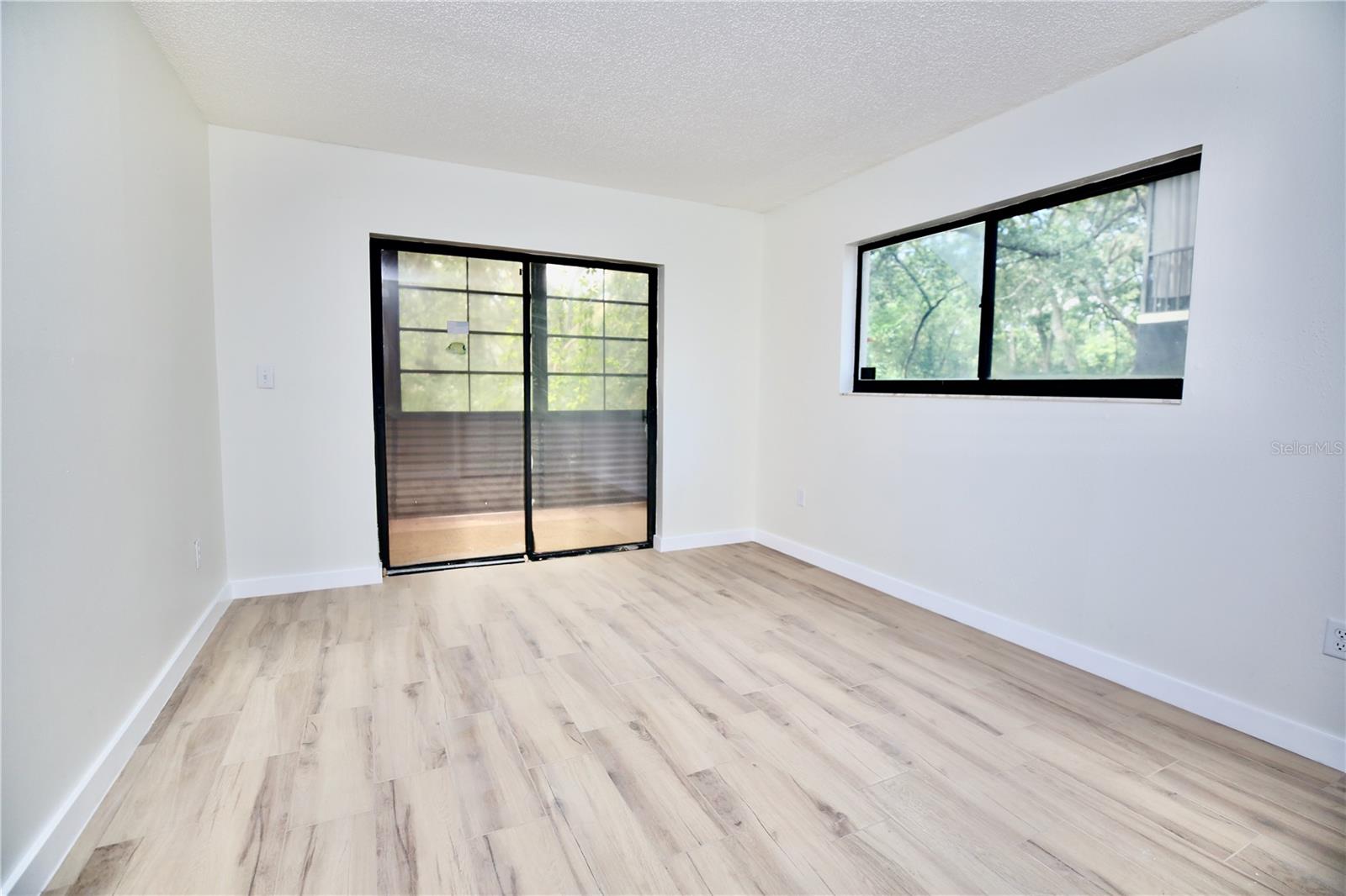 Guest bedroom with sliders to lanai