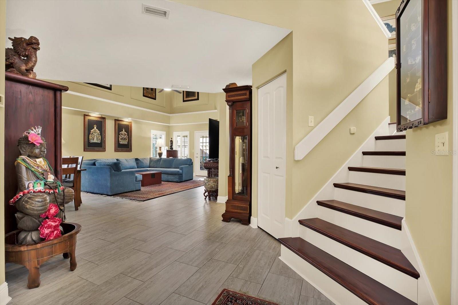 Entrance w soaring ceiling leads to Living Room or To Upstairs