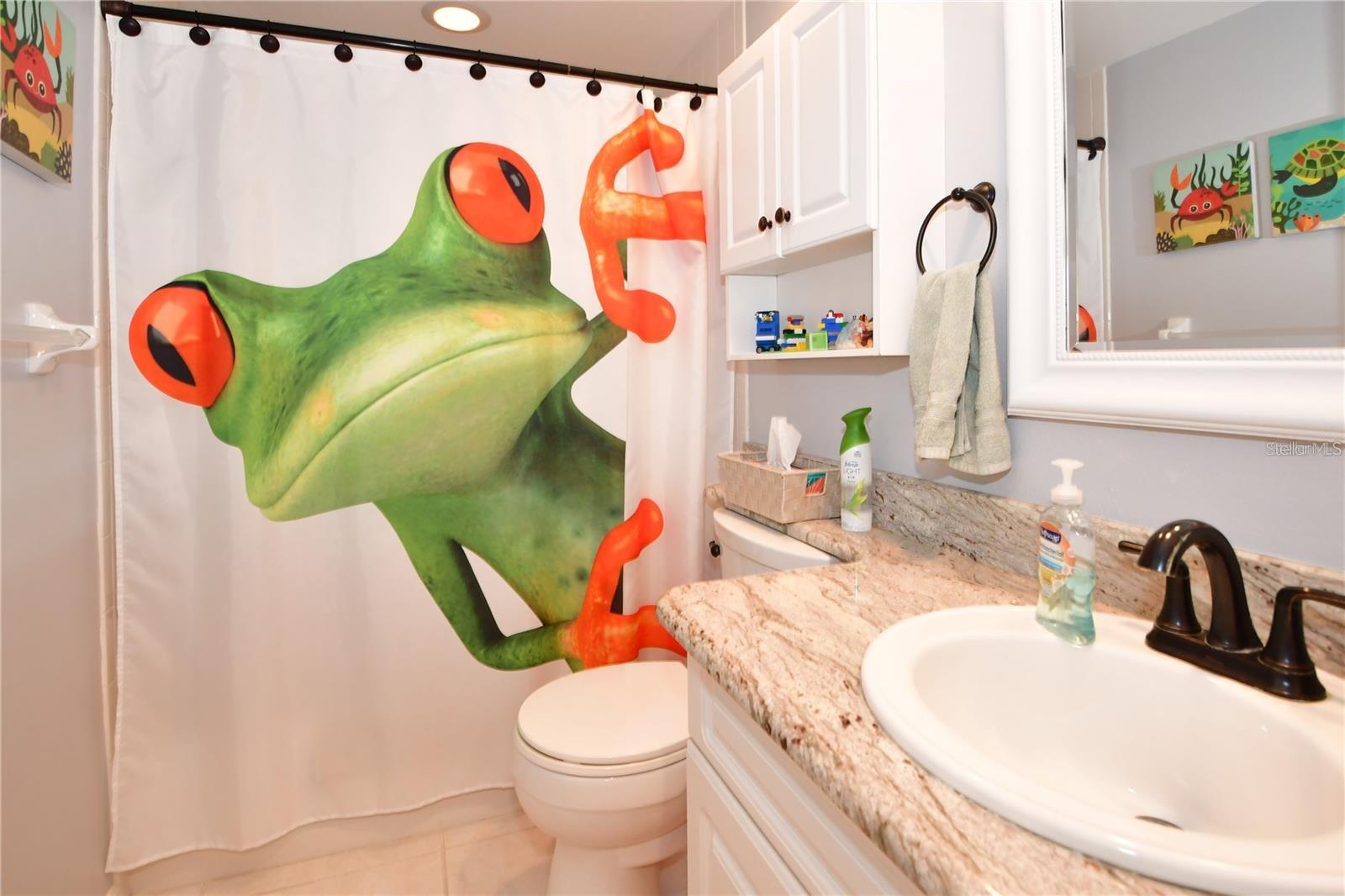 The guest bathroom is located next to the 2nd bedroom.