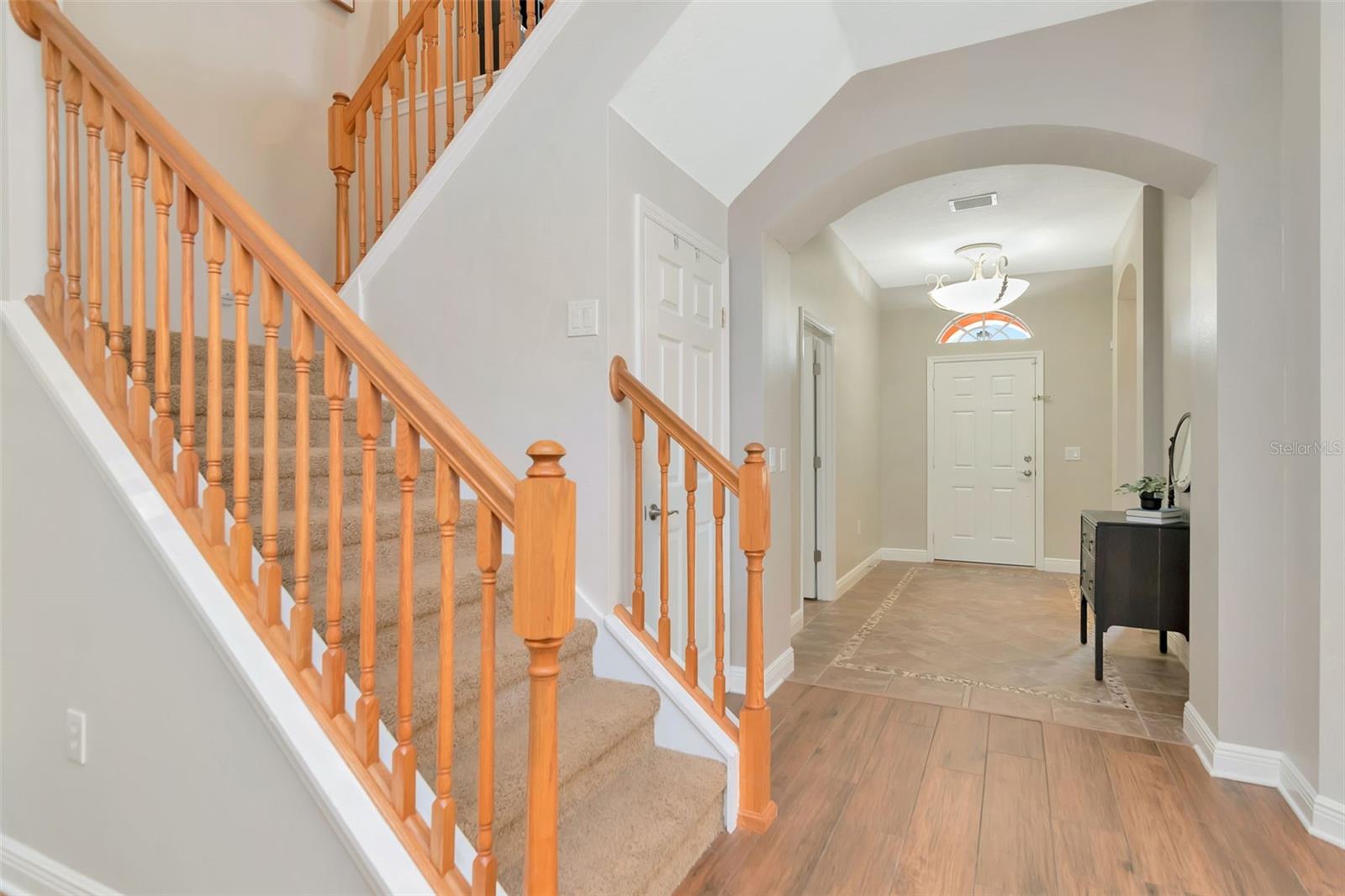 Staircase to Upper Level looking towards the  front door entry