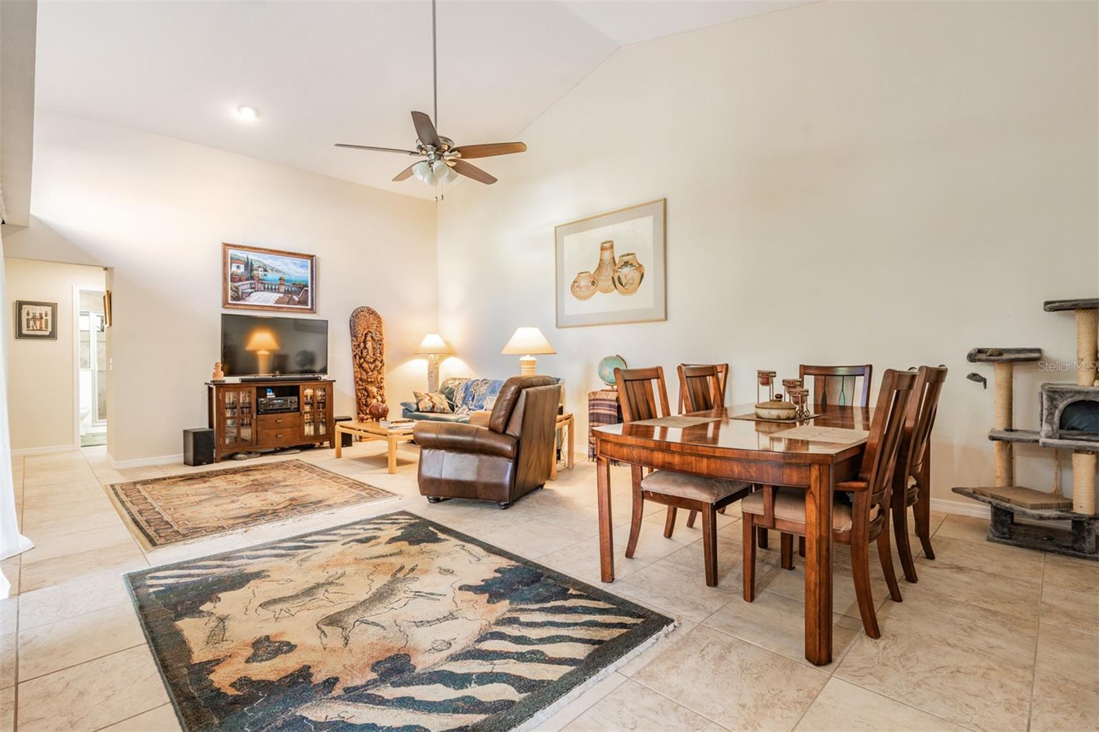 Family Room and Dining Room, Vaulted Ceilings, tile flooring, ceiling fan with light fixture