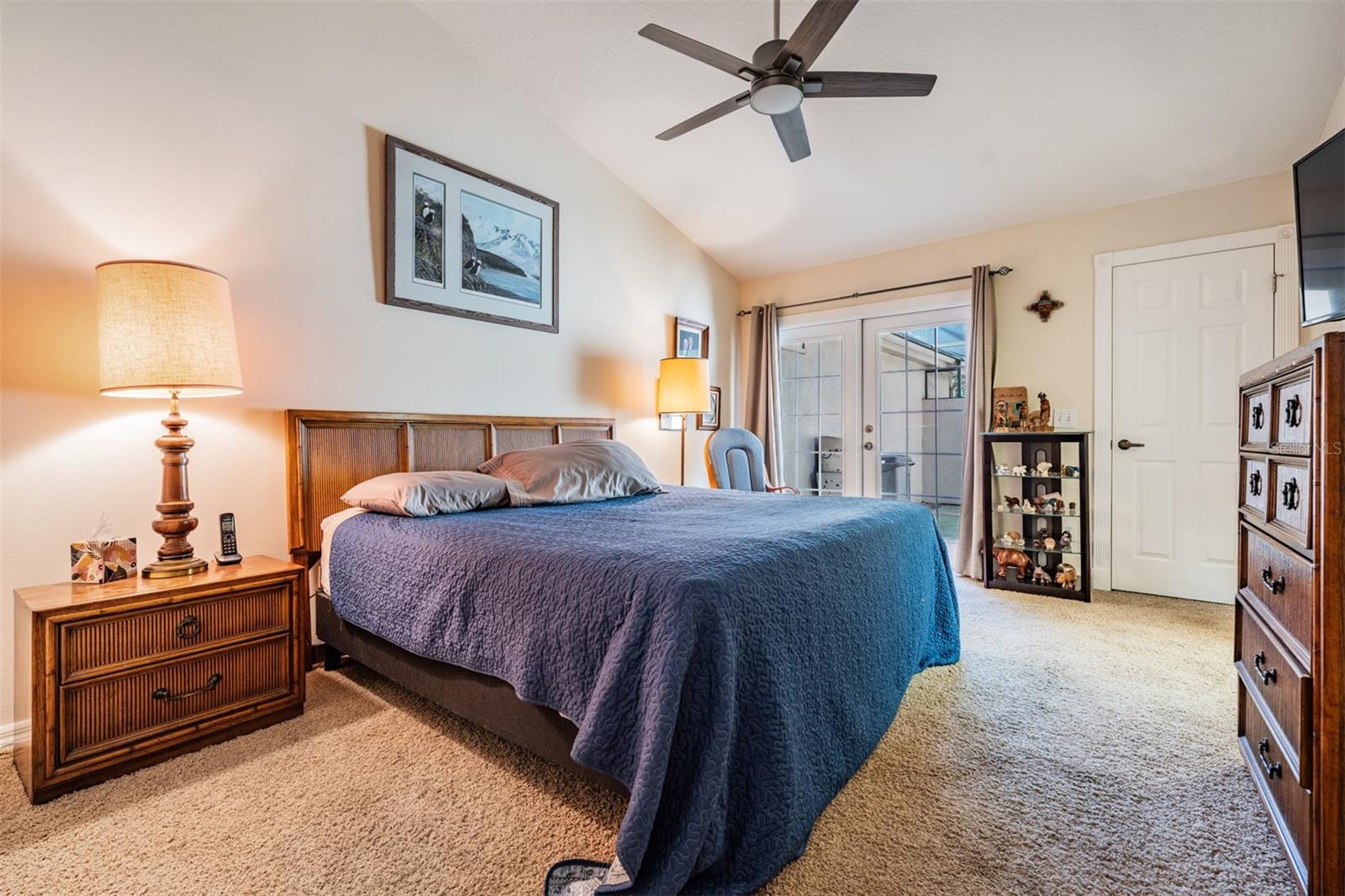 Master Bedroom (there is a screen-top porch outside of the french doors). Ceiling fan with Light and a walk in closet.