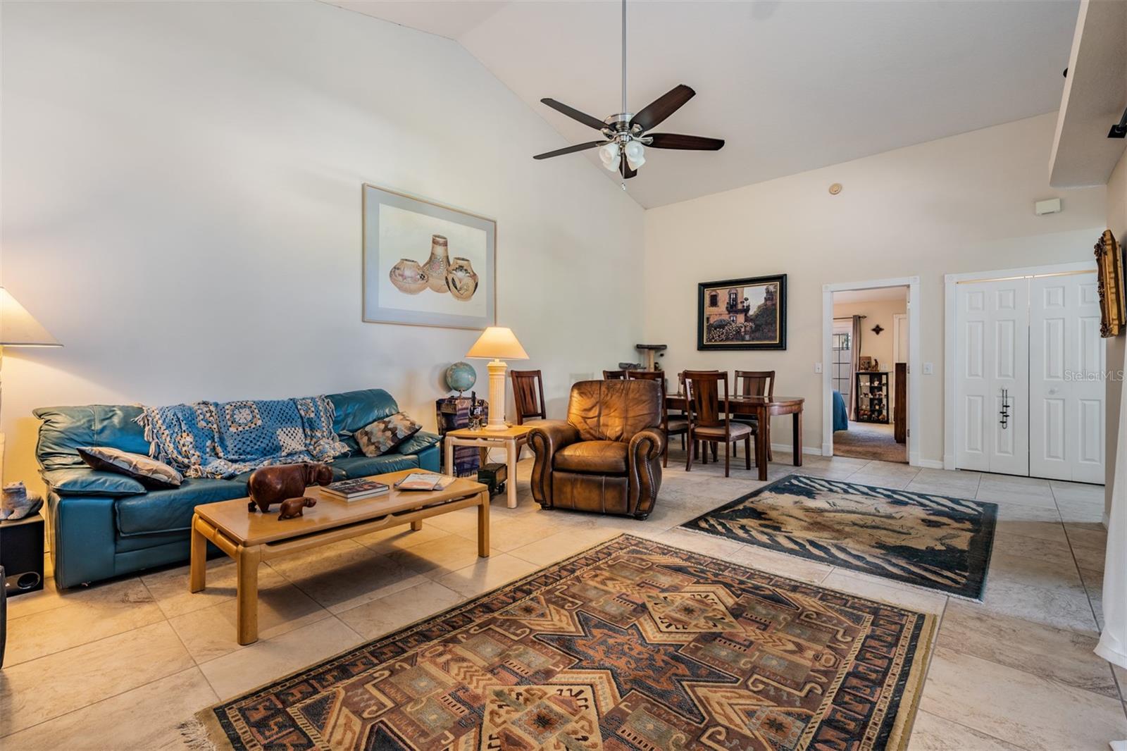 Family Room and Dining Room, Vaulted Ceilings, tile flooring, ceiling fan with light fixture