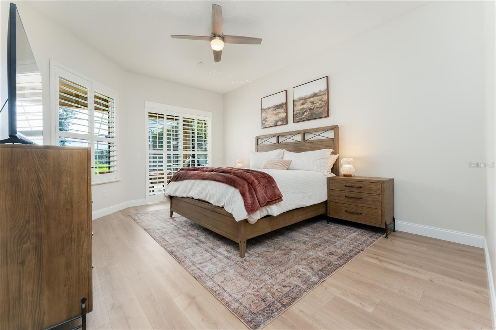 Primary Bedroom with Views of the Pool Area and Pond