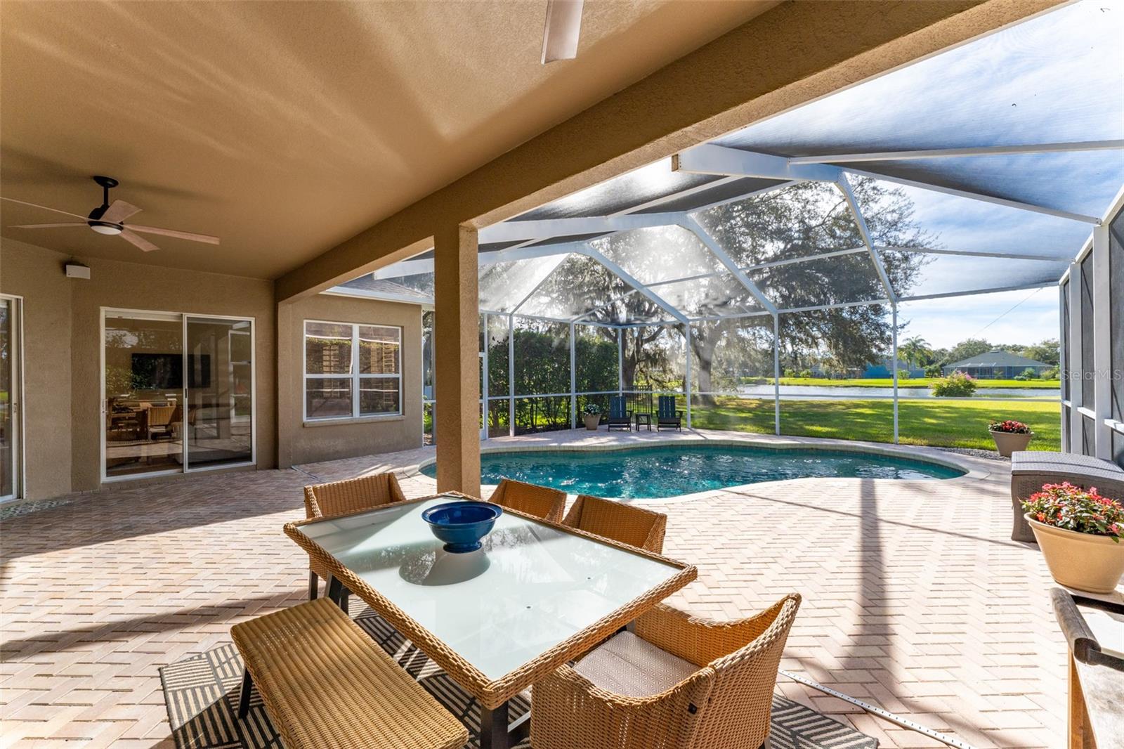 Pavered Screened-in Lanai with a Gorgeous Pond View