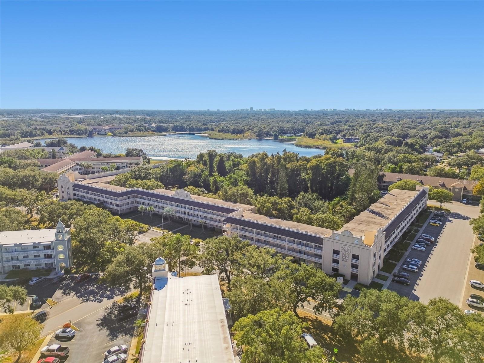 Aerial view of building and lake behind