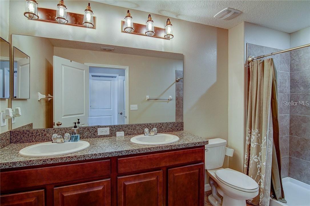 Primary Bath with Double Sinks and Walk-In Shower