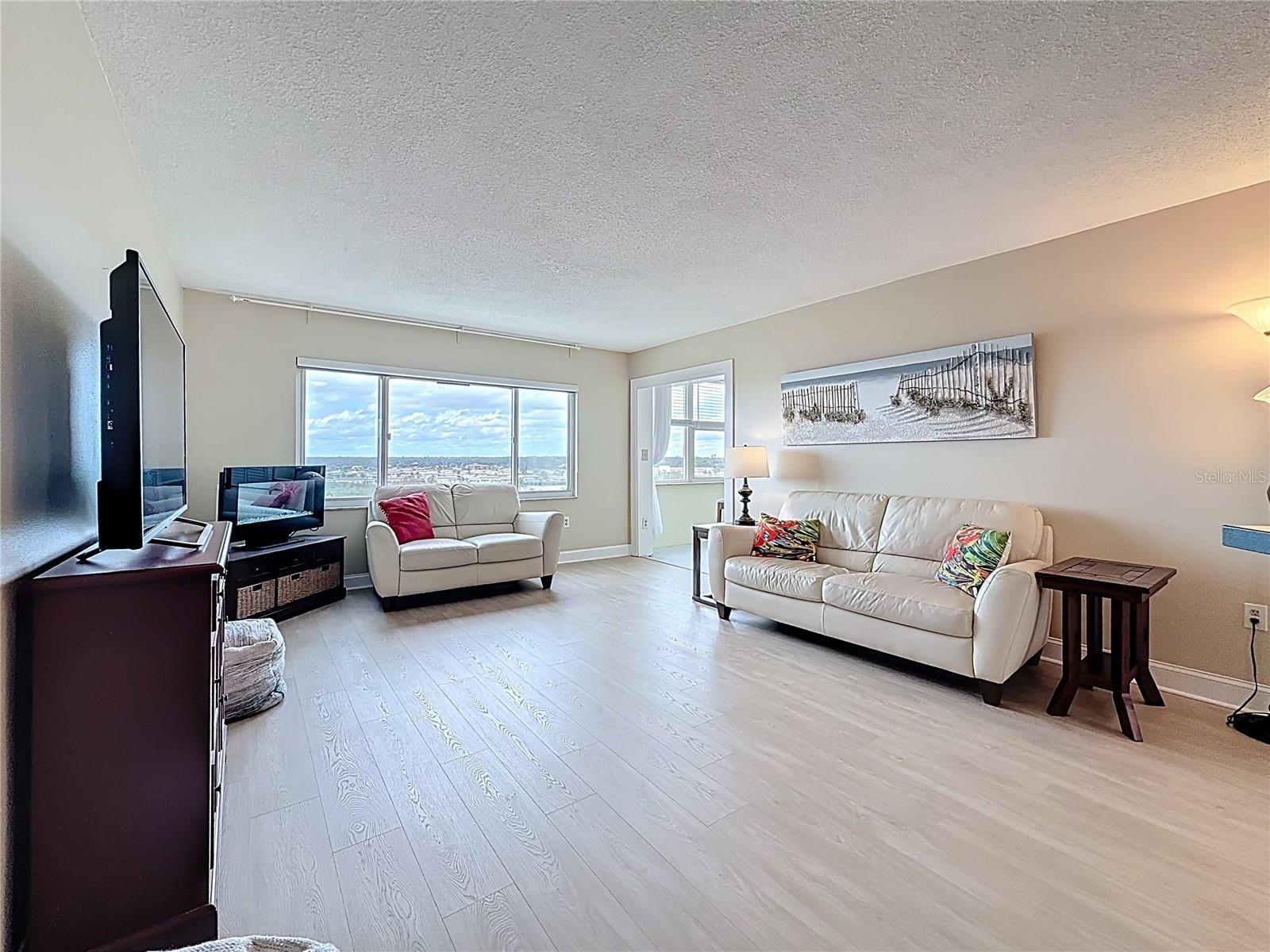 Notice the luxury vinyl planking in all of the living area! So easy to maintain. Your spacious living room has very nice views of the water.