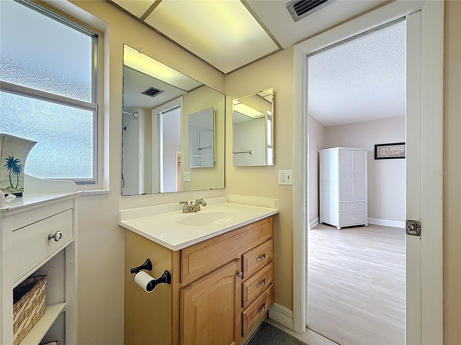 Notice your vanity in the primary bathroom offers lots of storage and is at a higher height for convenience