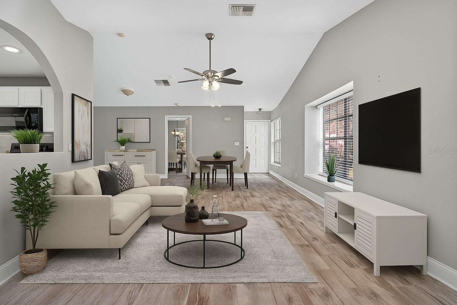 This photo has been virtually staged. Living/Dining Room combo