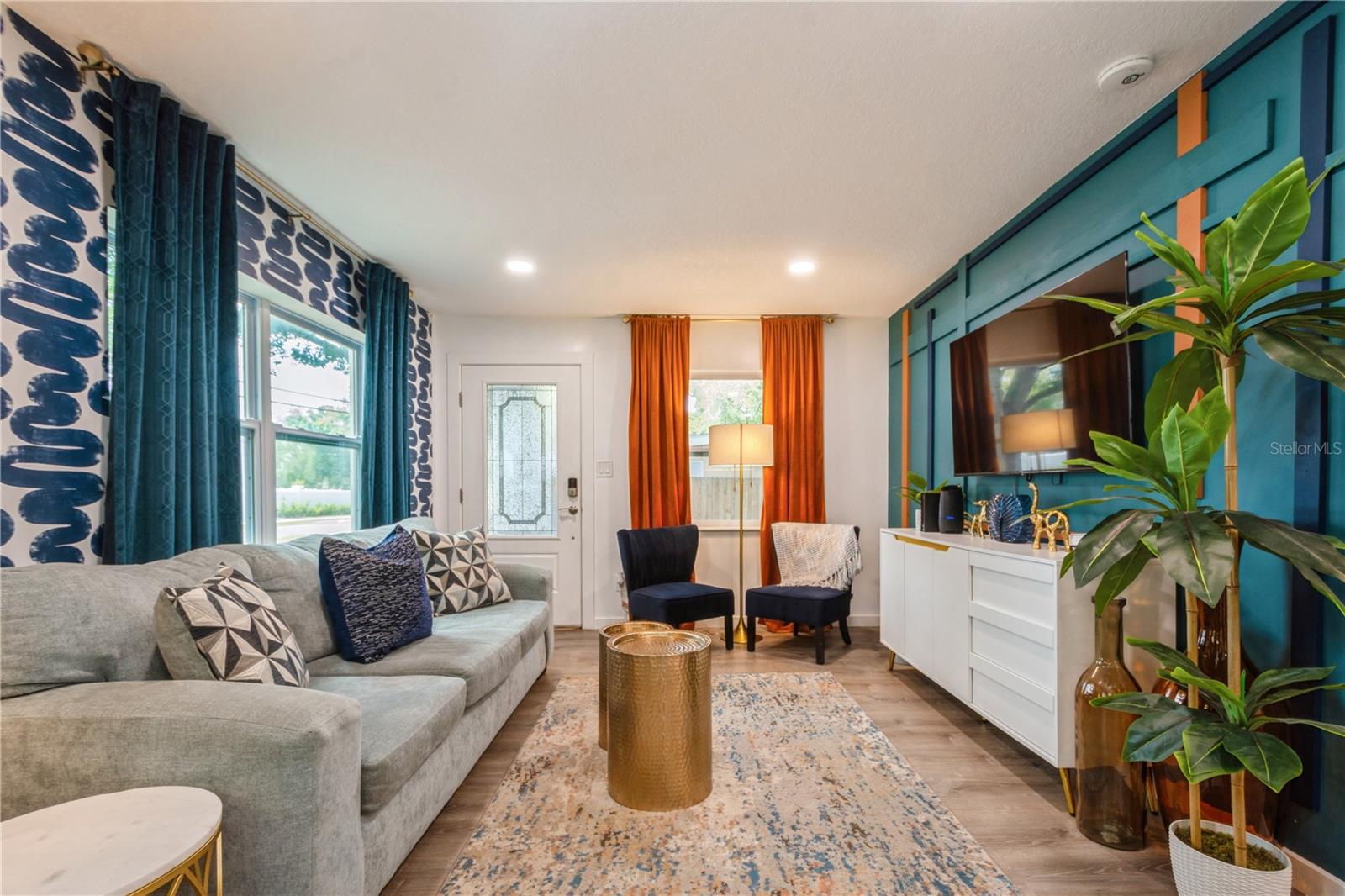 Living room with modern, updated decor. Provided fully furnished!