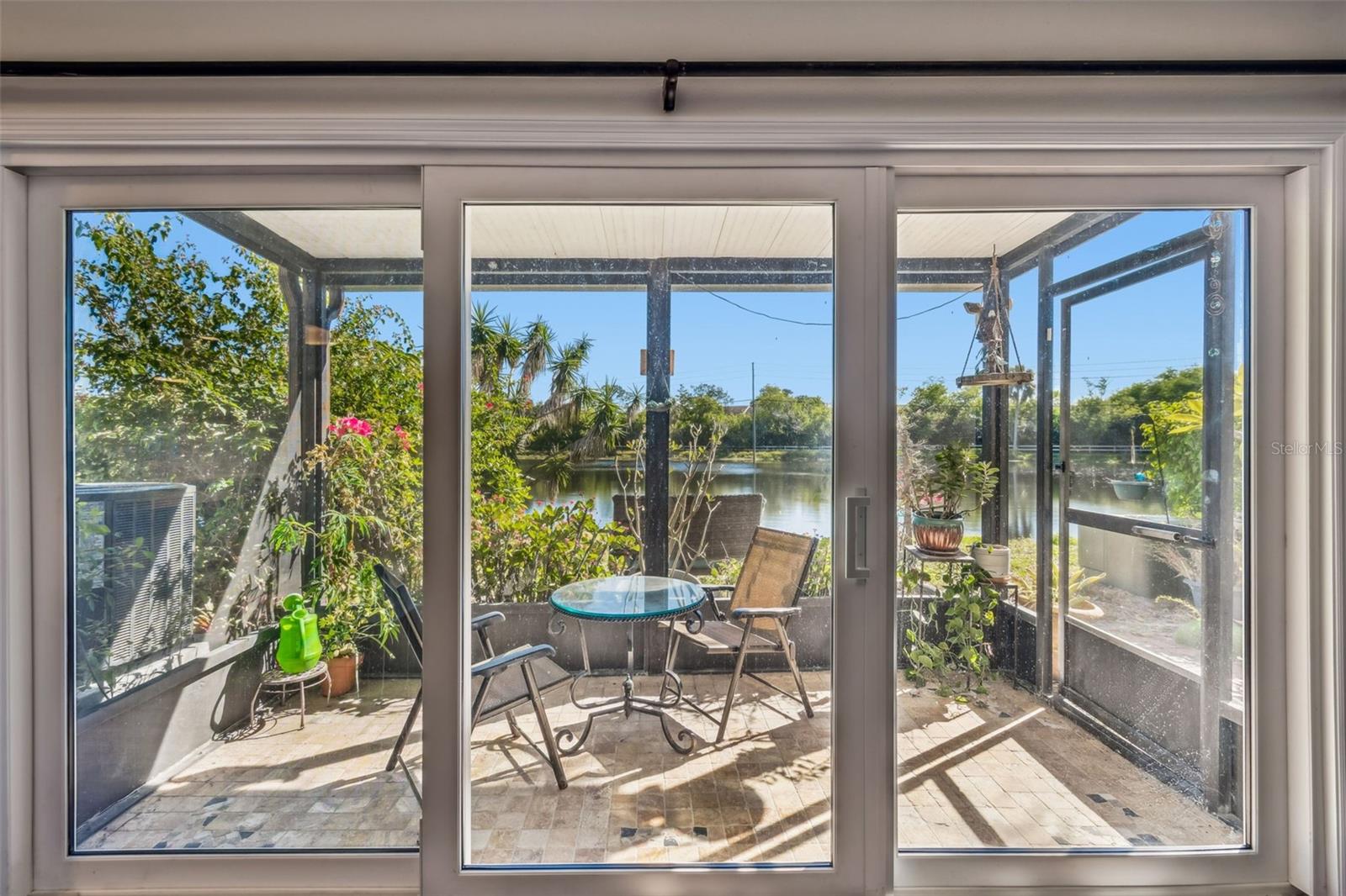 Sliding Glass Doors w/Sliding Door Access to Screened Lanai