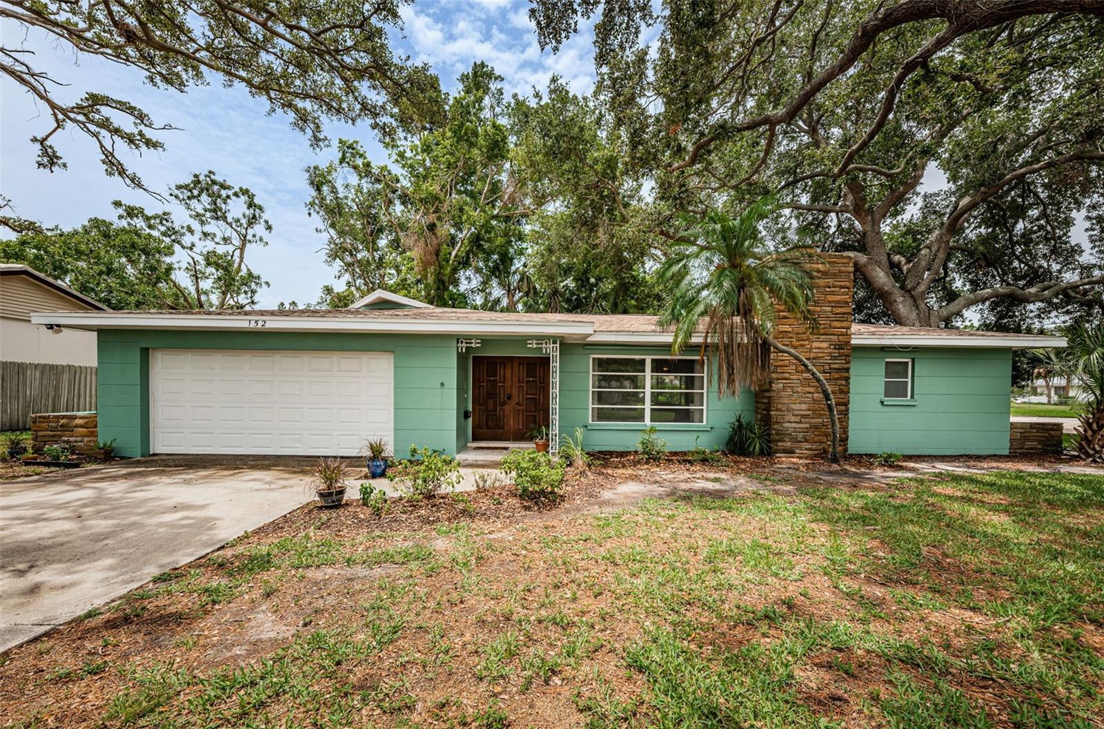 Mid Century terrazzo dream home on huge corner lot.