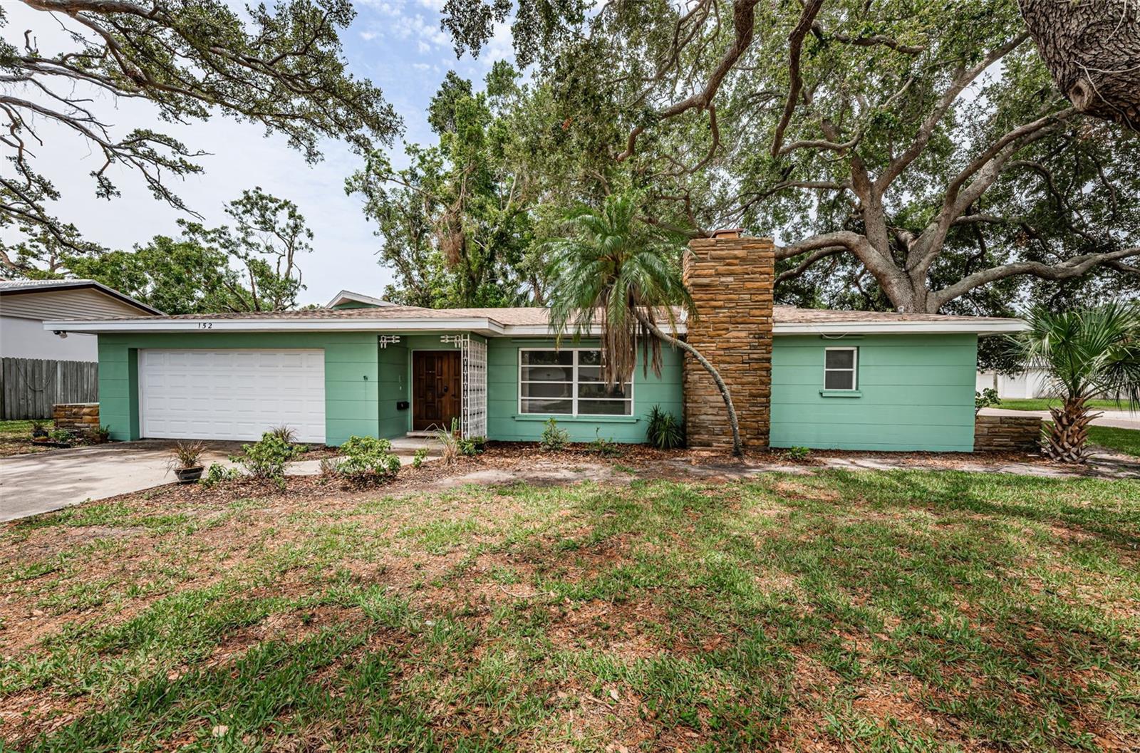 Mid Century terrazzo dream home on huge corner lot.