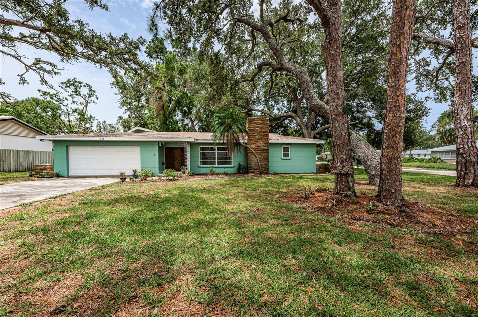 Mid Century terrazzo dream home on huge corner lot.