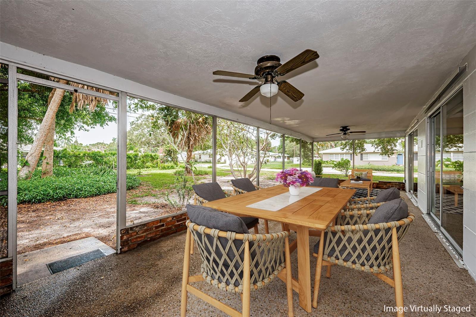 Large screened porch which overlooks the rear yard.