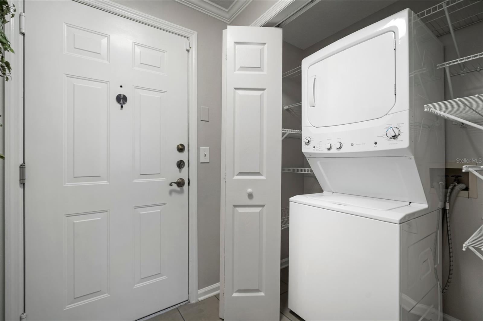 Laundry closet with added shelving