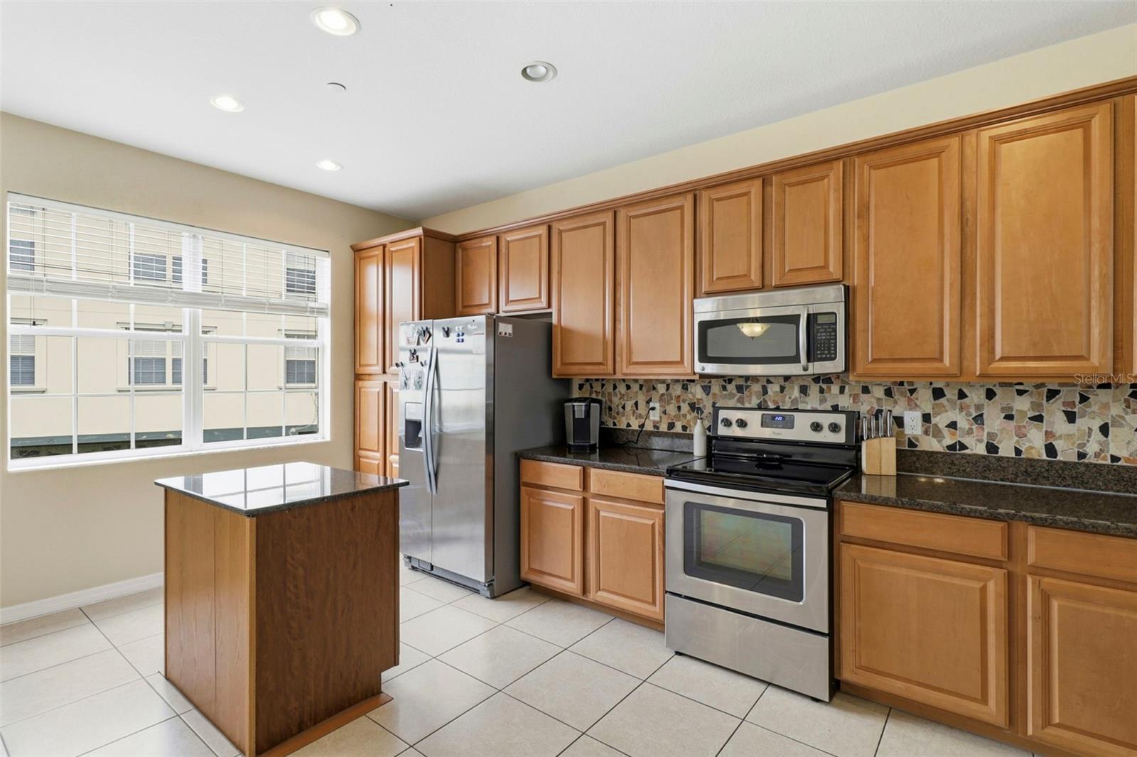 Kitchen with granite counters and Stainless Steel appliances
