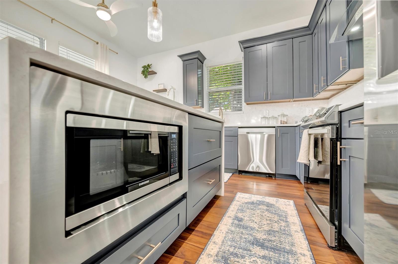 Kitchen island with built in microwave drawer