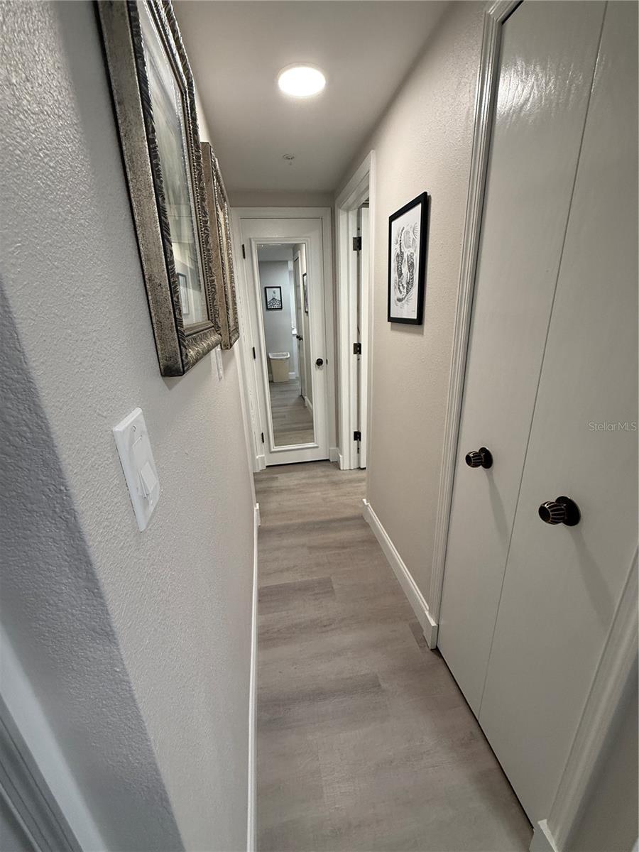 Hallway between bedroom and bathroom