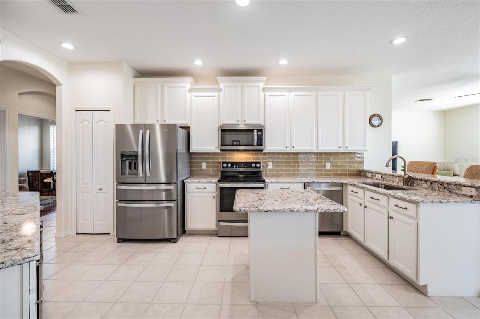 Thoughtful kitchen layout with all stainless appliances