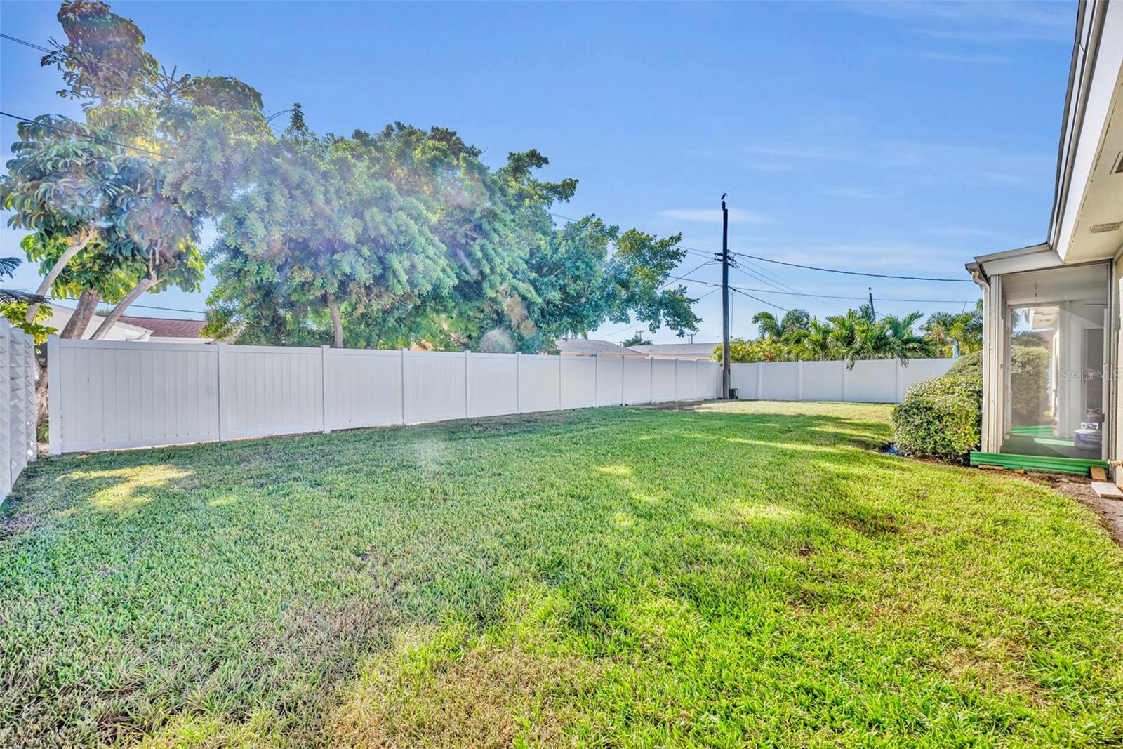 Fenced in backyard with plenty of room for a pool