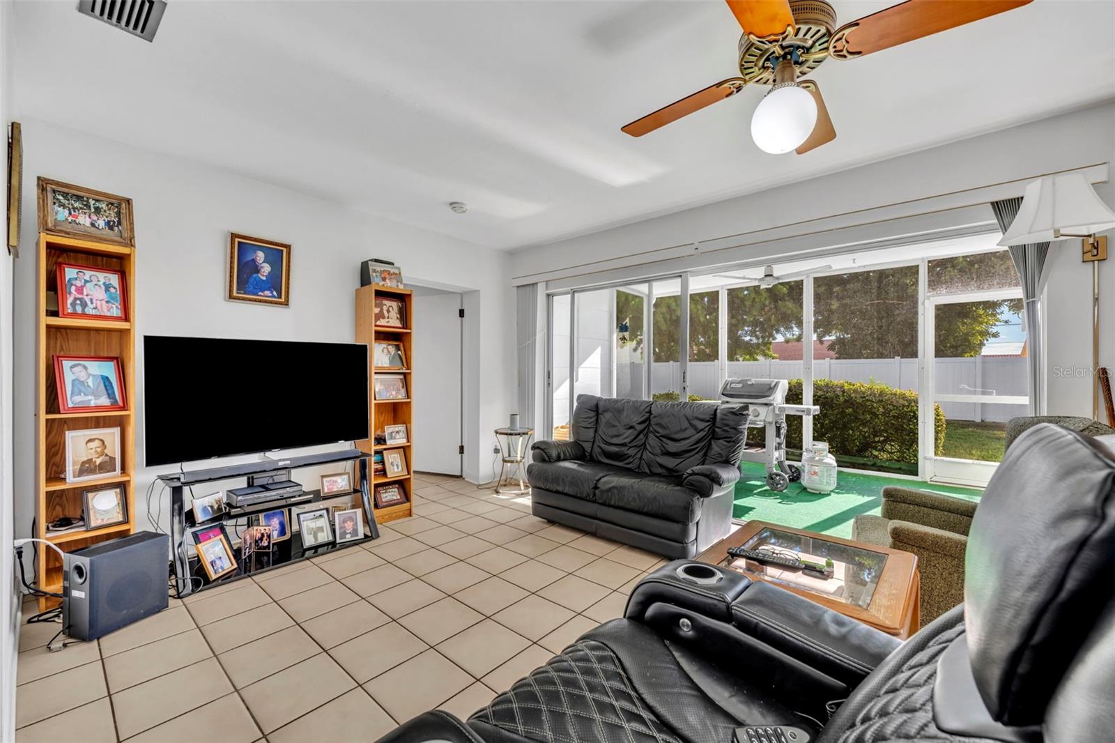 Family Room over looking the back screened in porch and backyard
